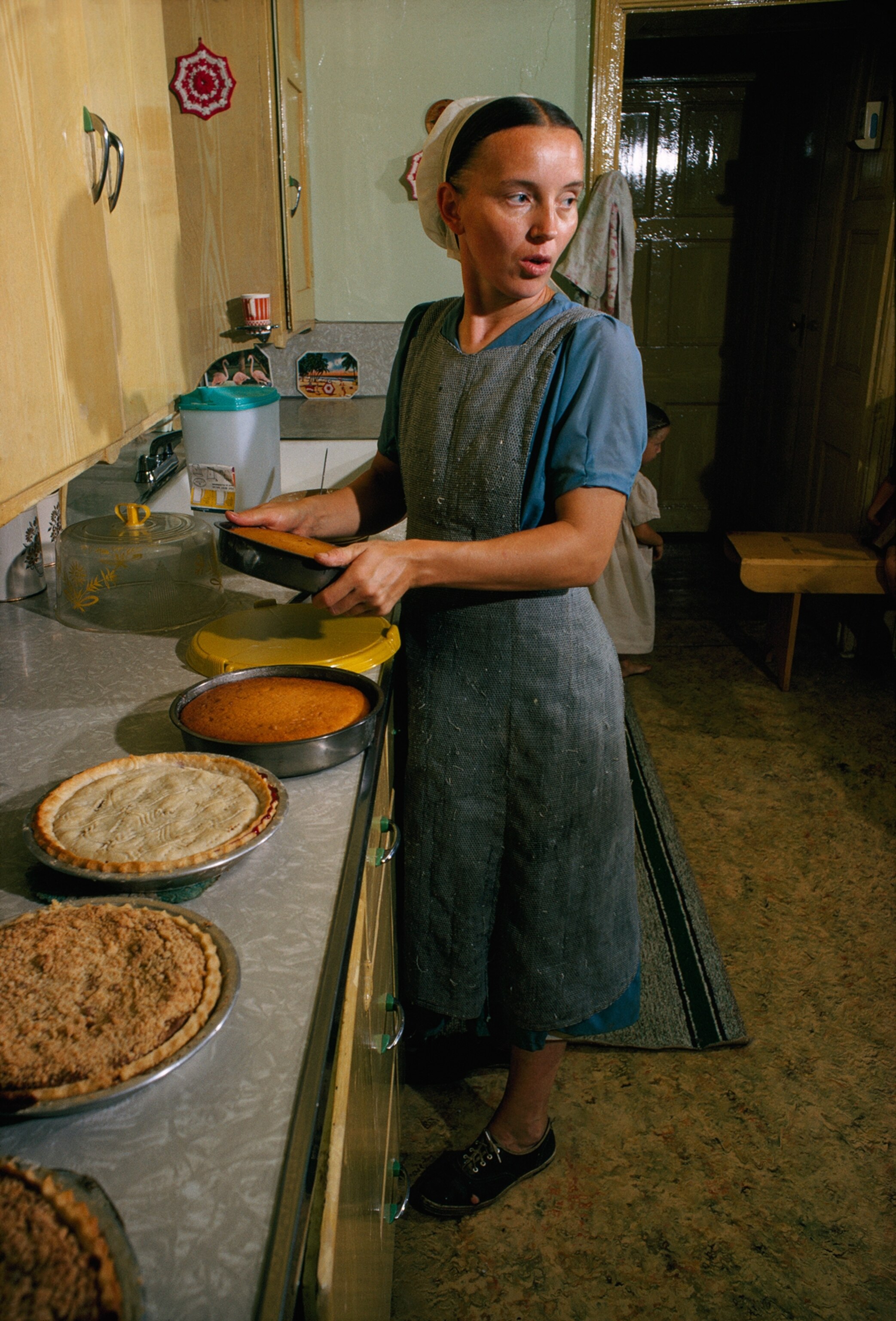Amish woman holding pie