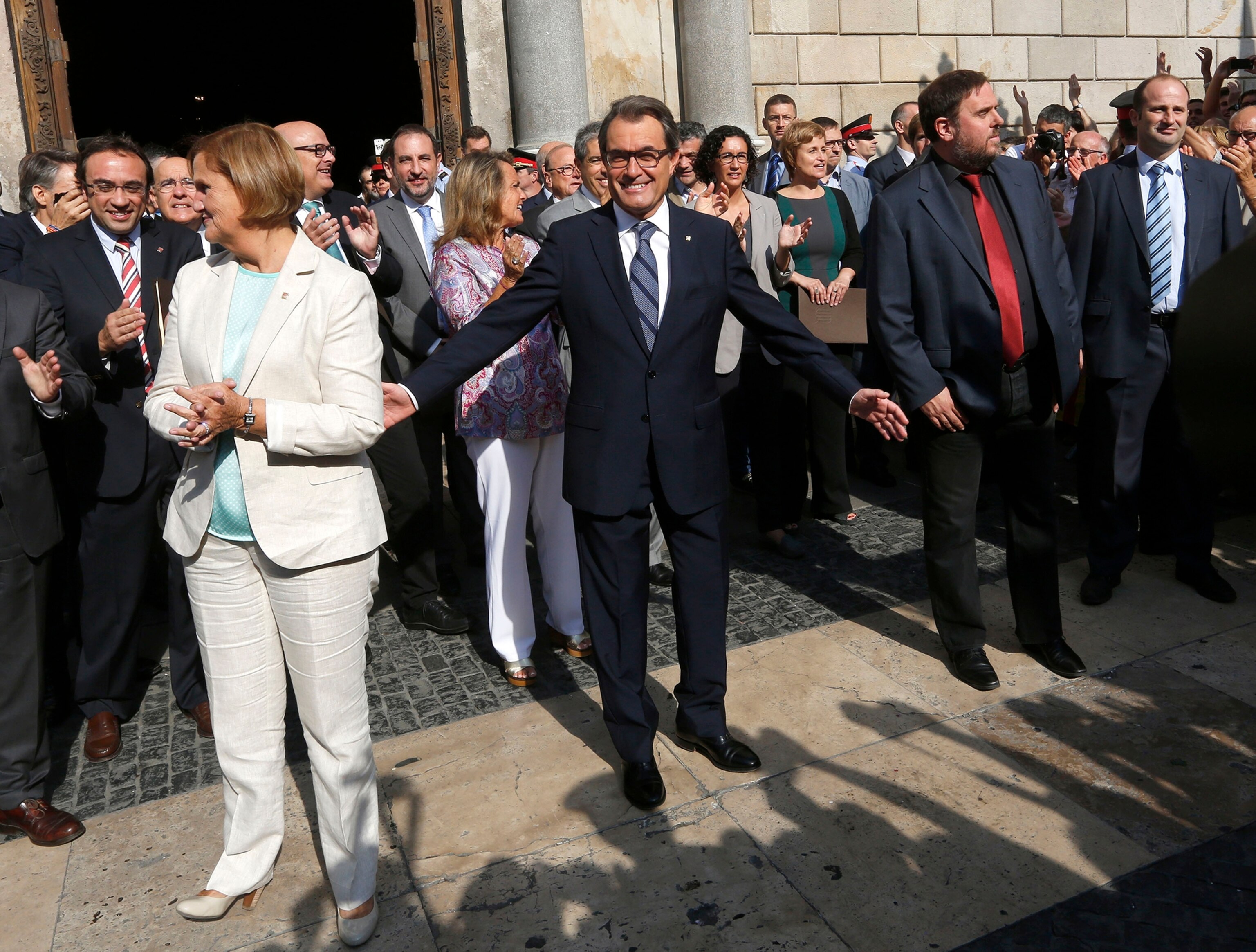 People hold "estelada" flags, Catalan separatist flags, during a gathering to mark the Calatalonia day "Diada" in central Barcelona September 11, 2014.