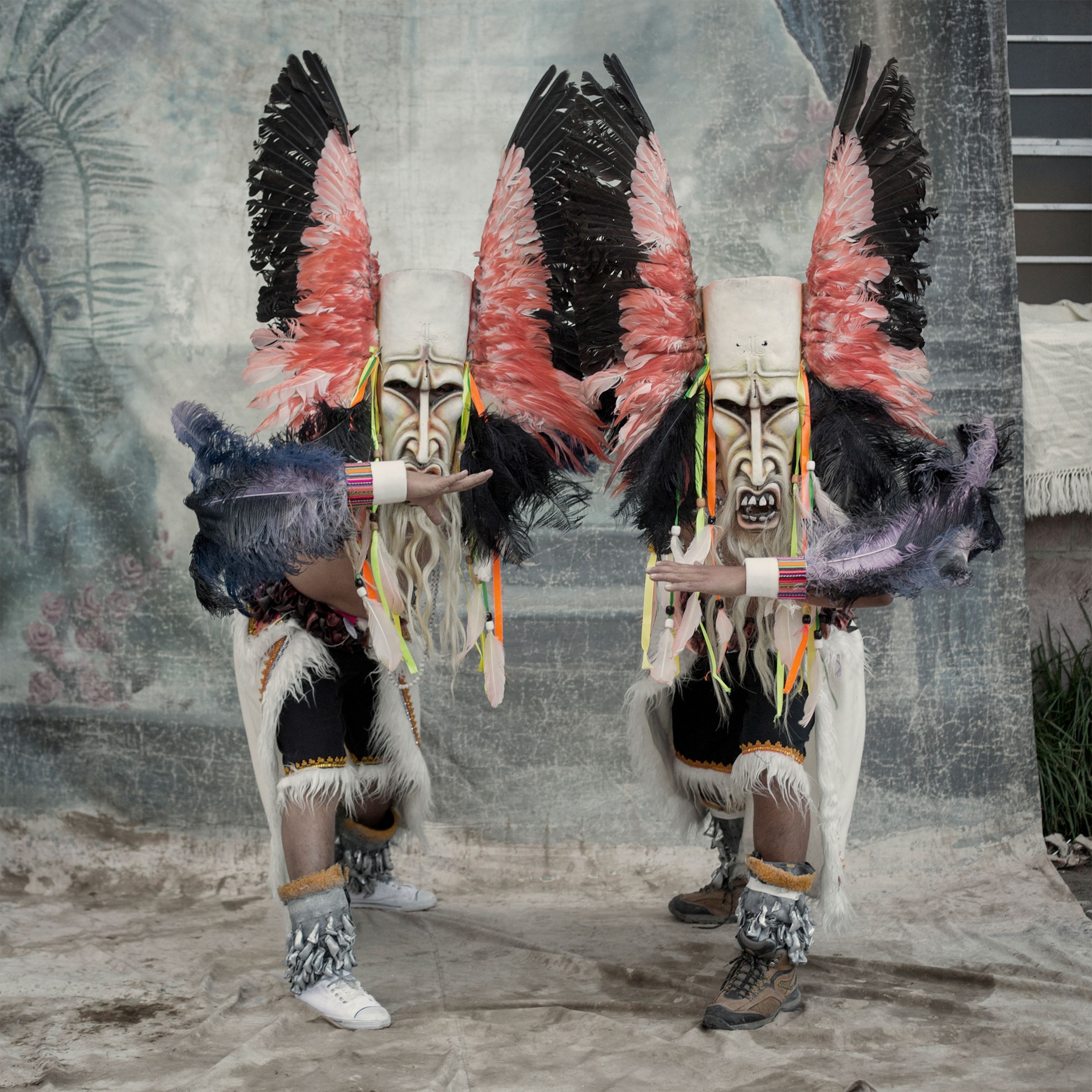 two masked performers at the Candelaria Festival in Peru