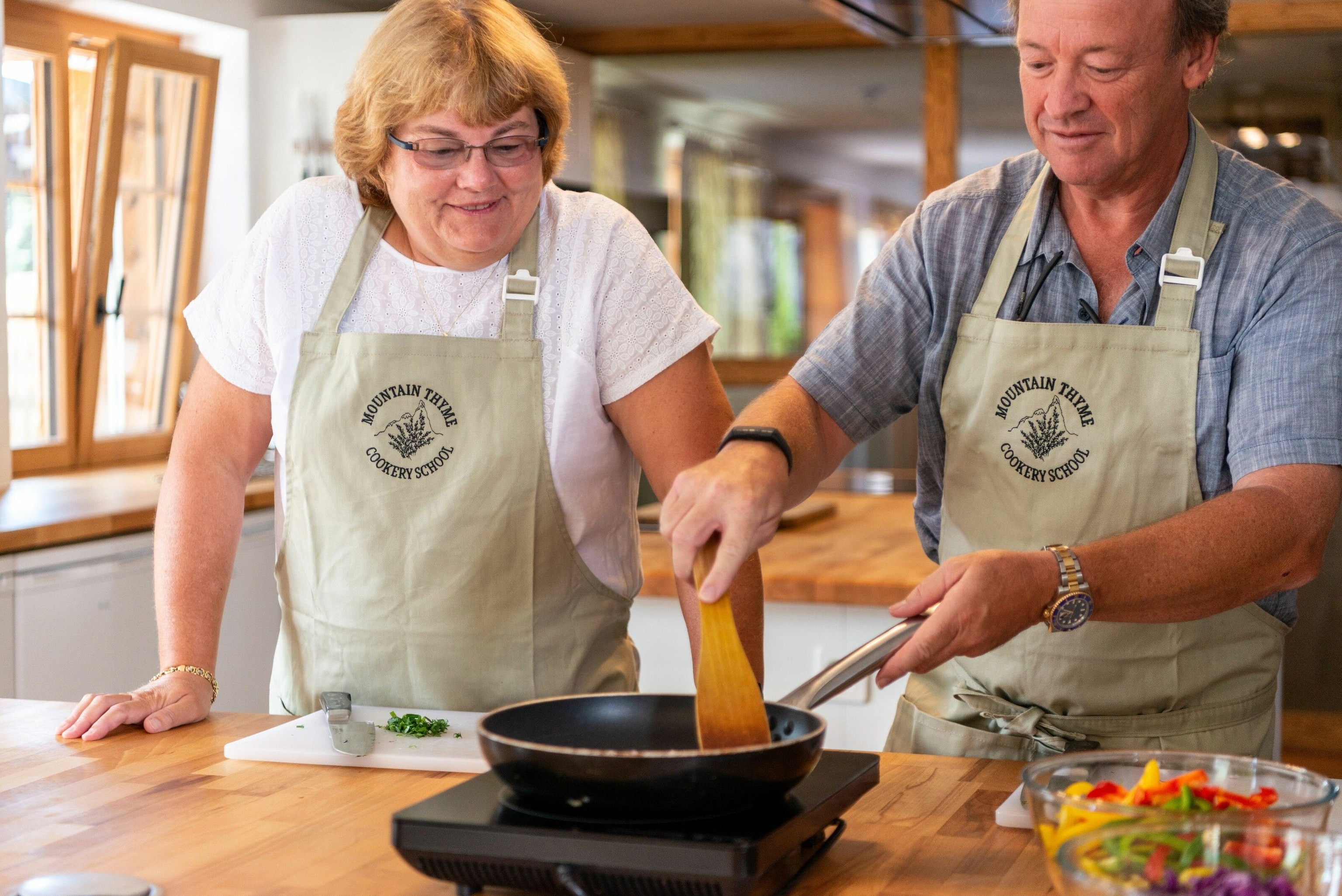 A woman and a man doing a cooking workshop