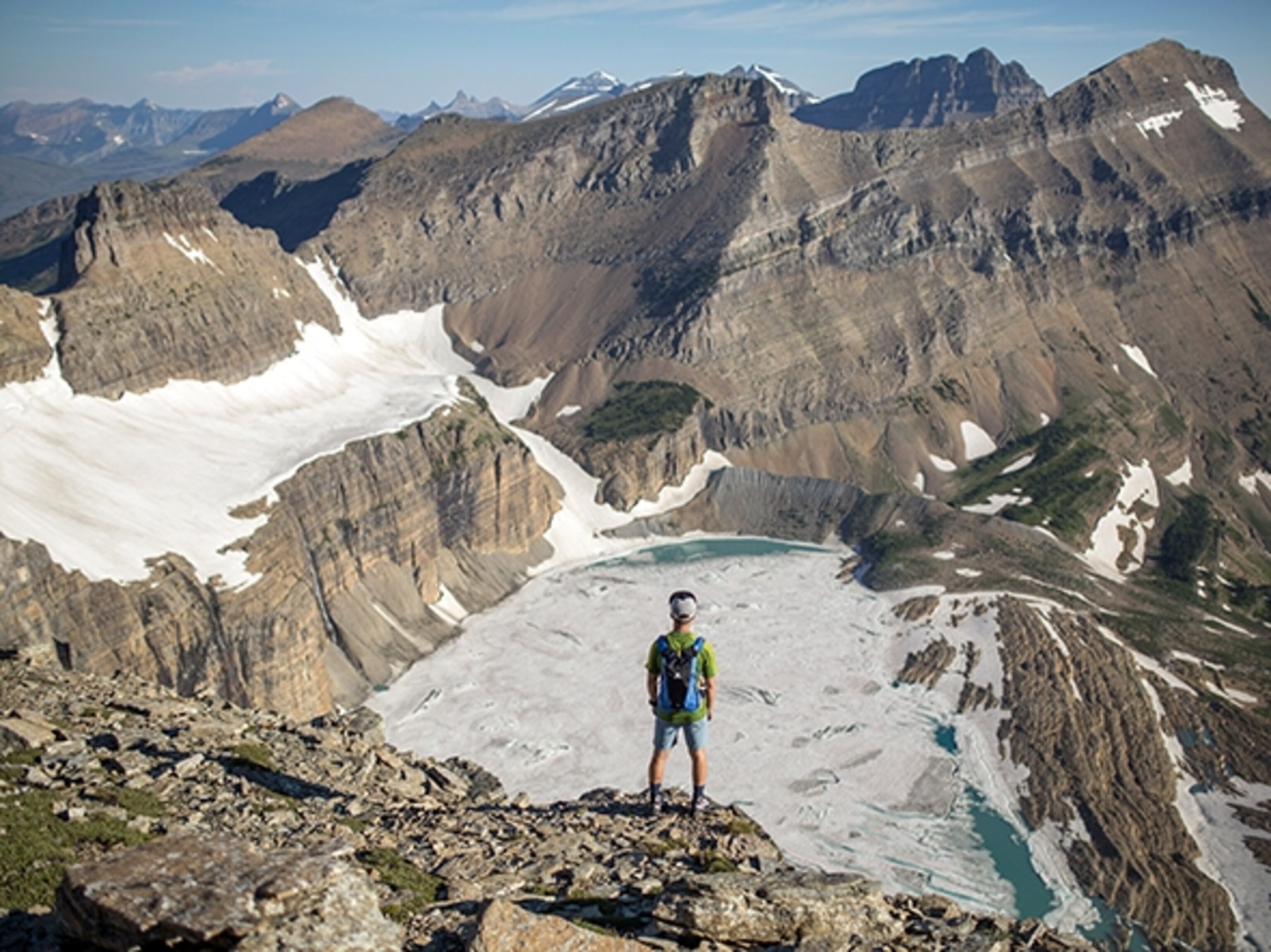 Brody Leven looks out on the Salamander Glacier on the ascent of Mt. Gould in Glacier National Park: Photograph by Graeme MacPherson