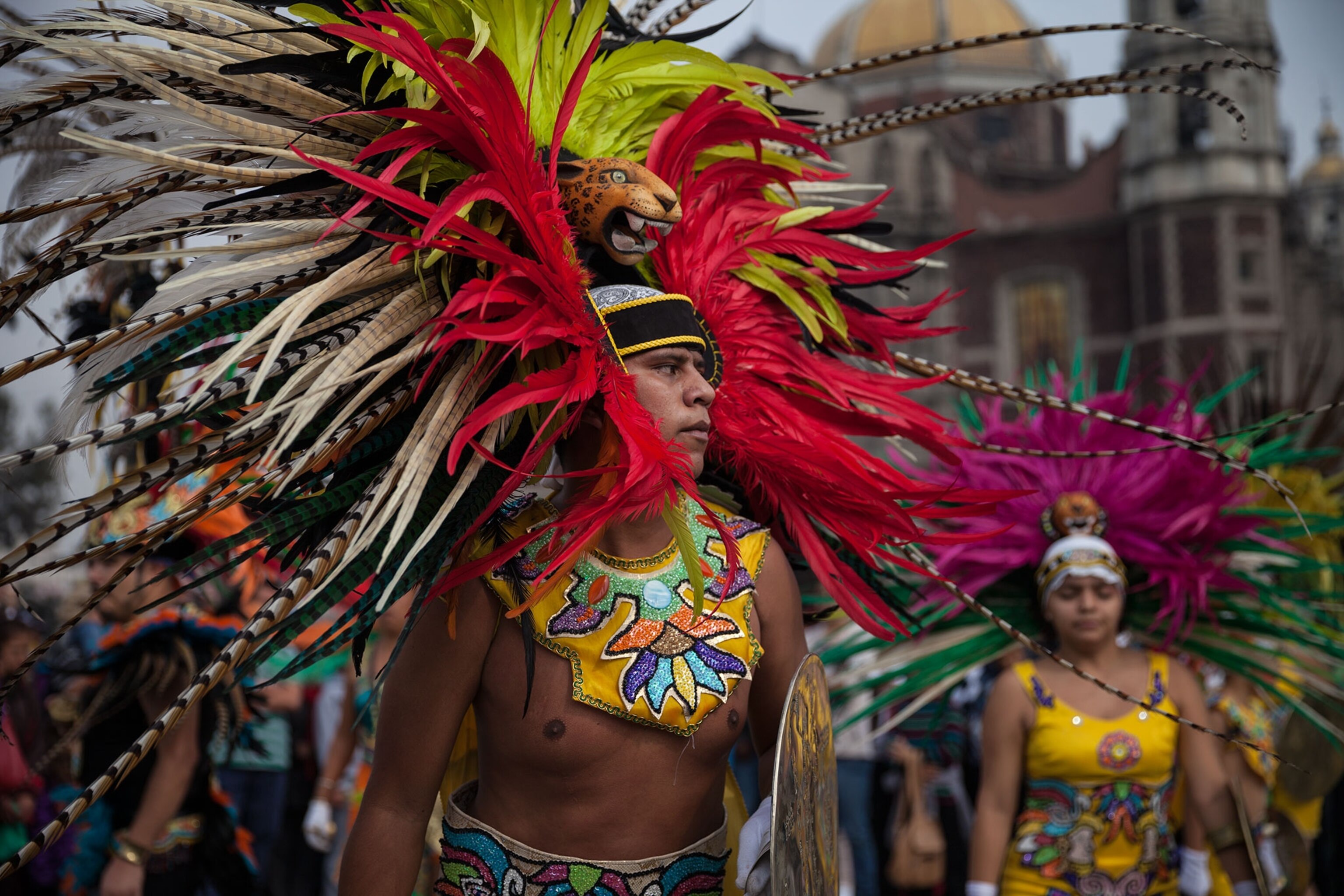 a man in a feathered headdress.