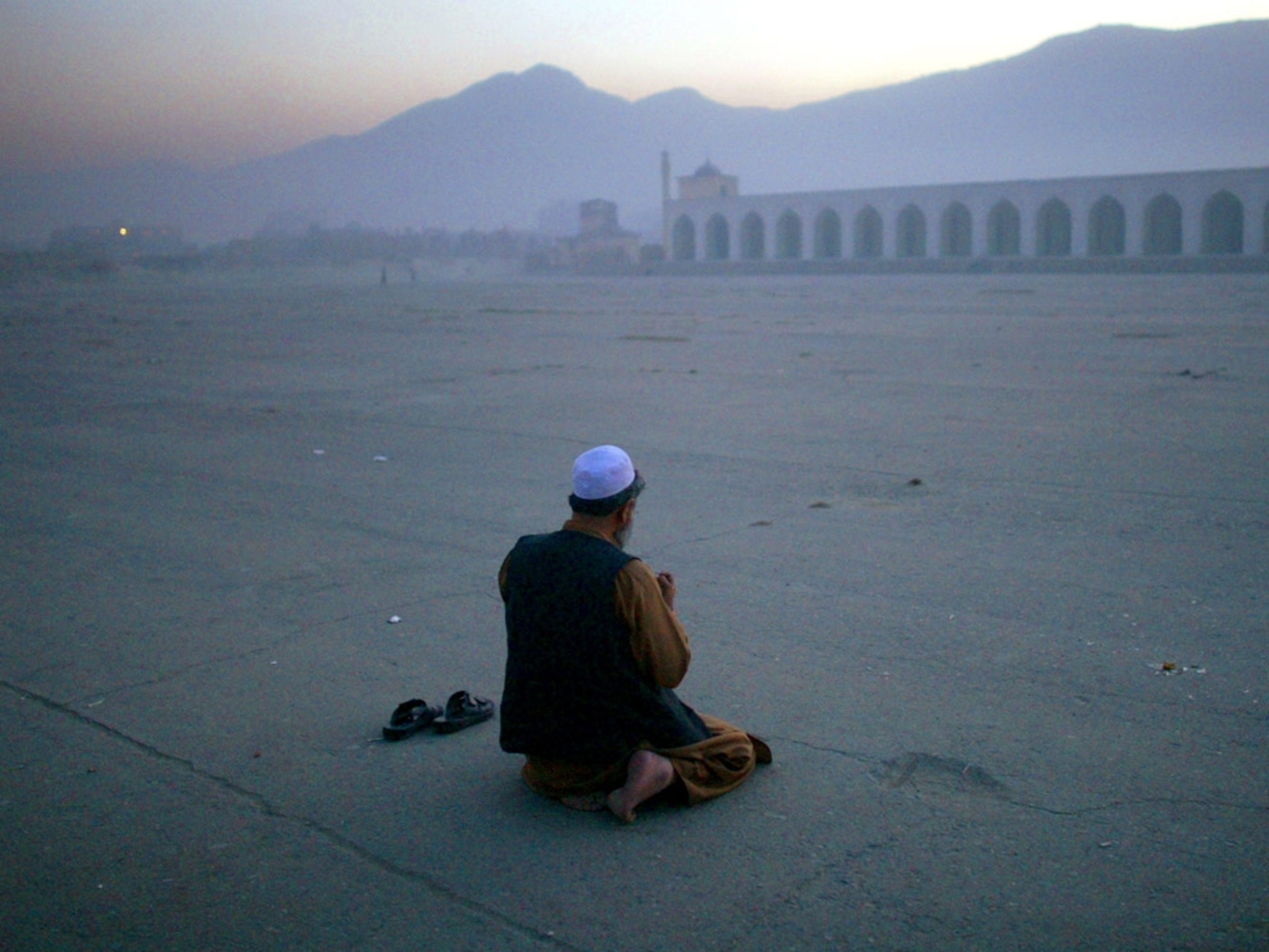Man praying in Kabul, Afghanistan