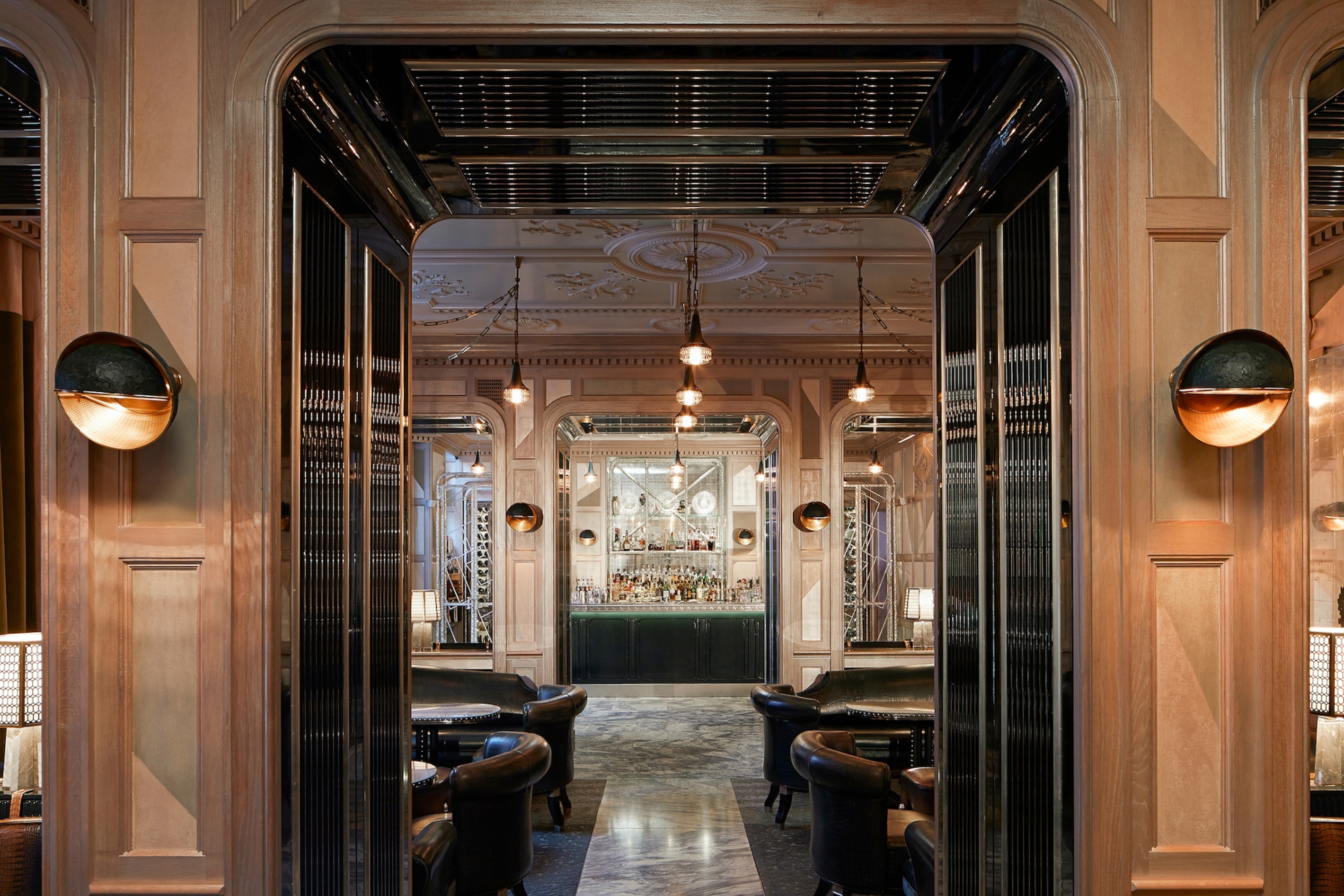 A marble-floored bar with arched walkways and art deco interiors.