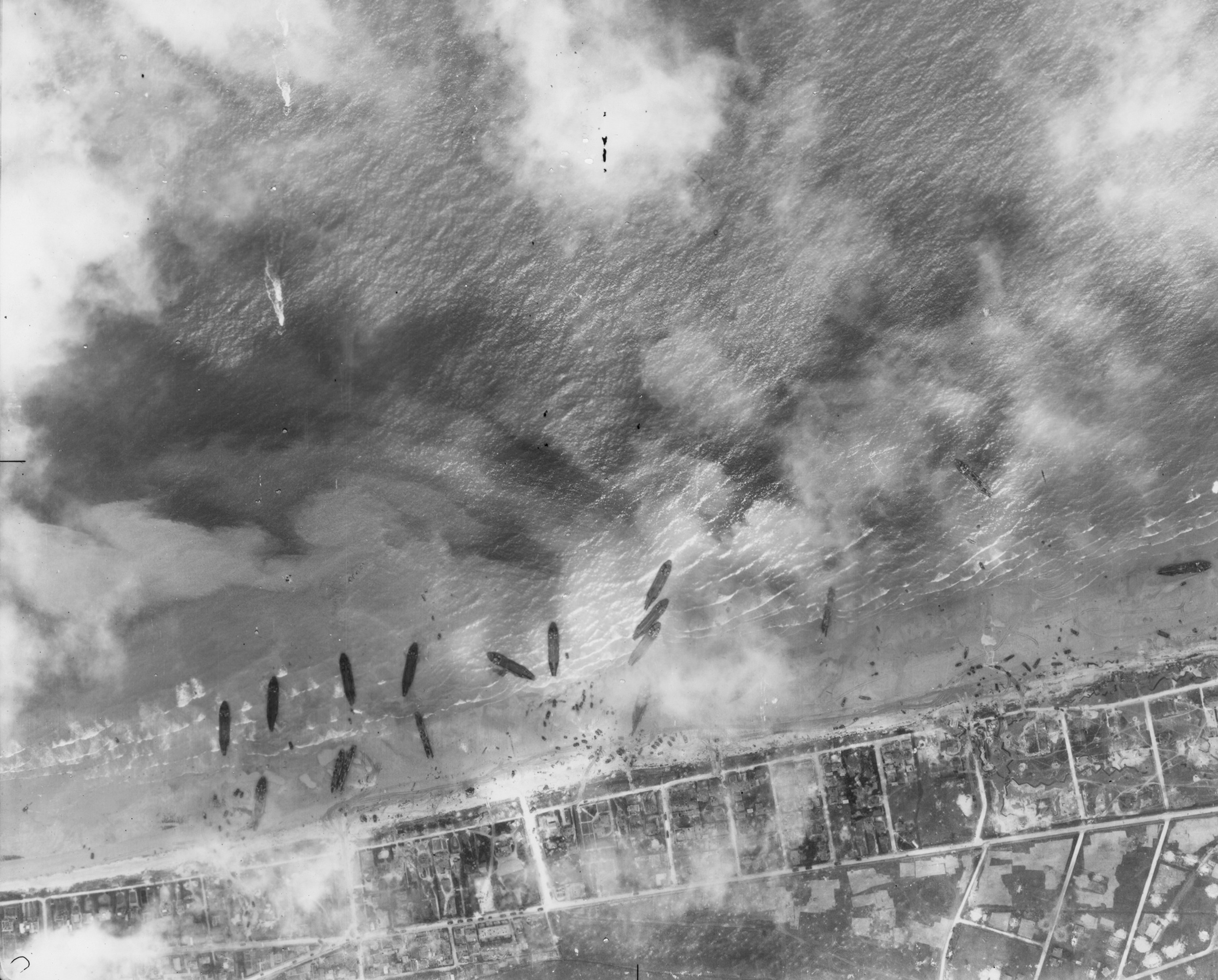 A number of Landing Craft from the first waves of the D-Day landings lie grounded on SWORD Beach.