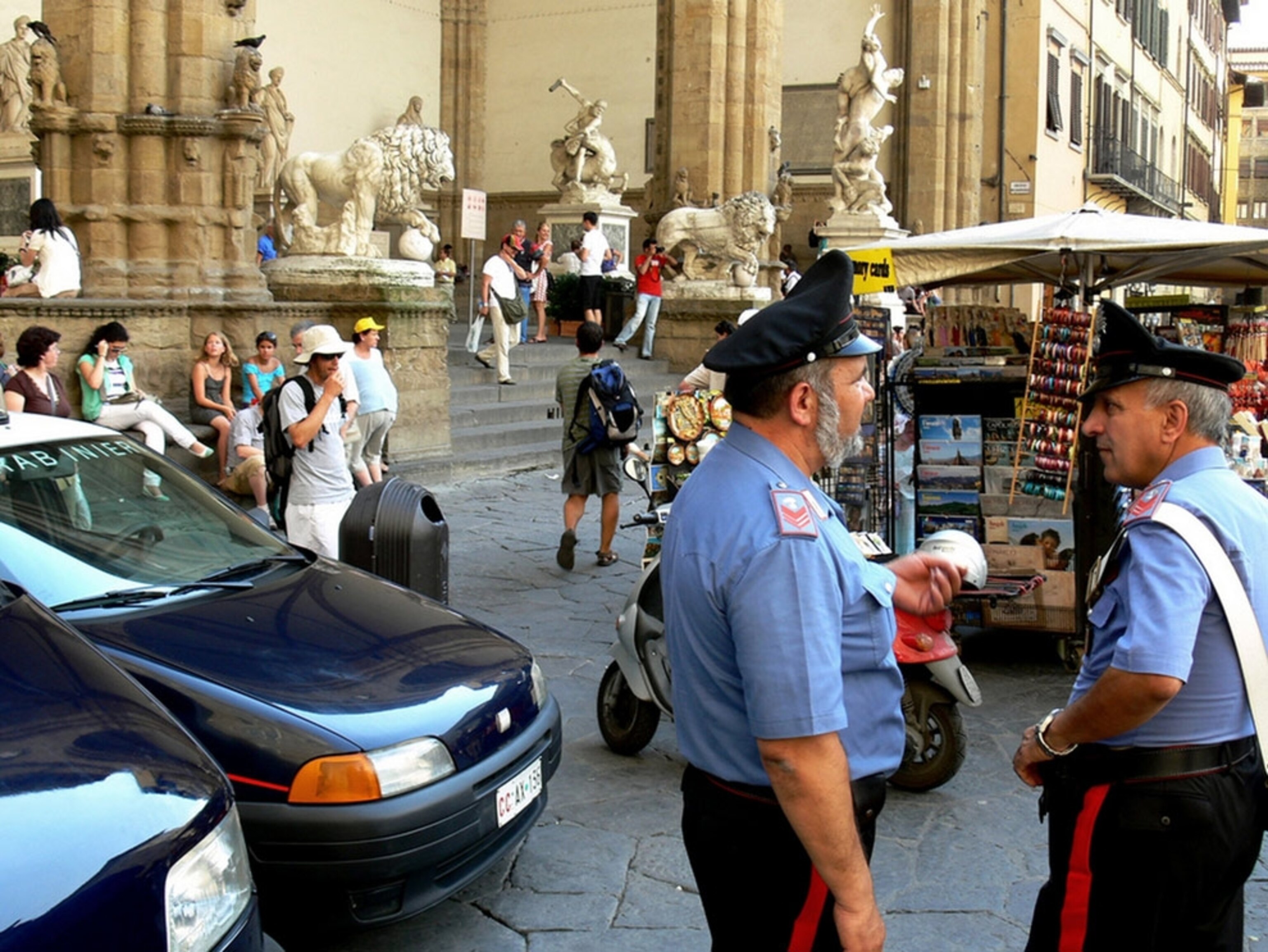 Policemen standing in front of sculptures