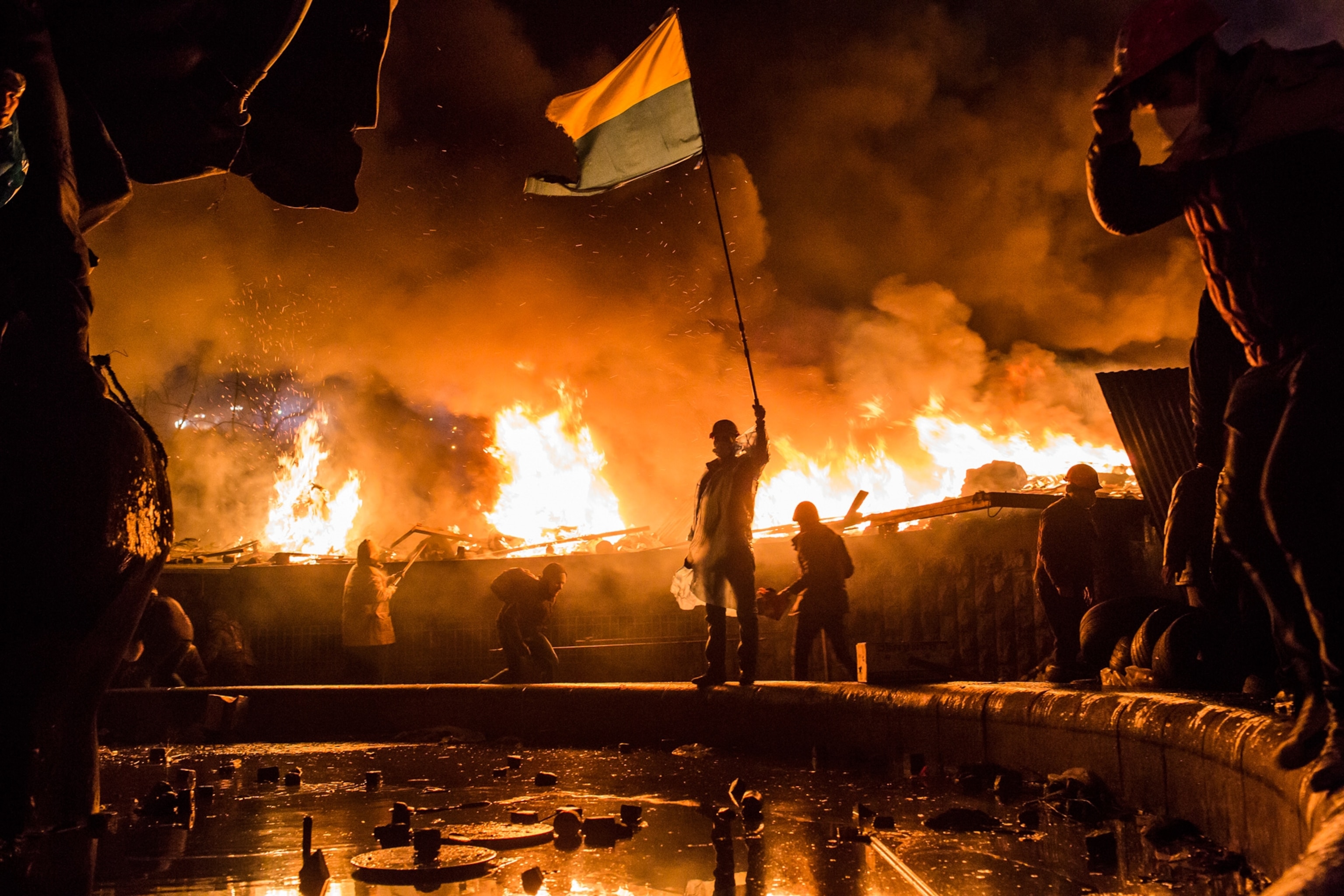 Anti-government protesters guard the perimeter of Independence Square in Kiev.