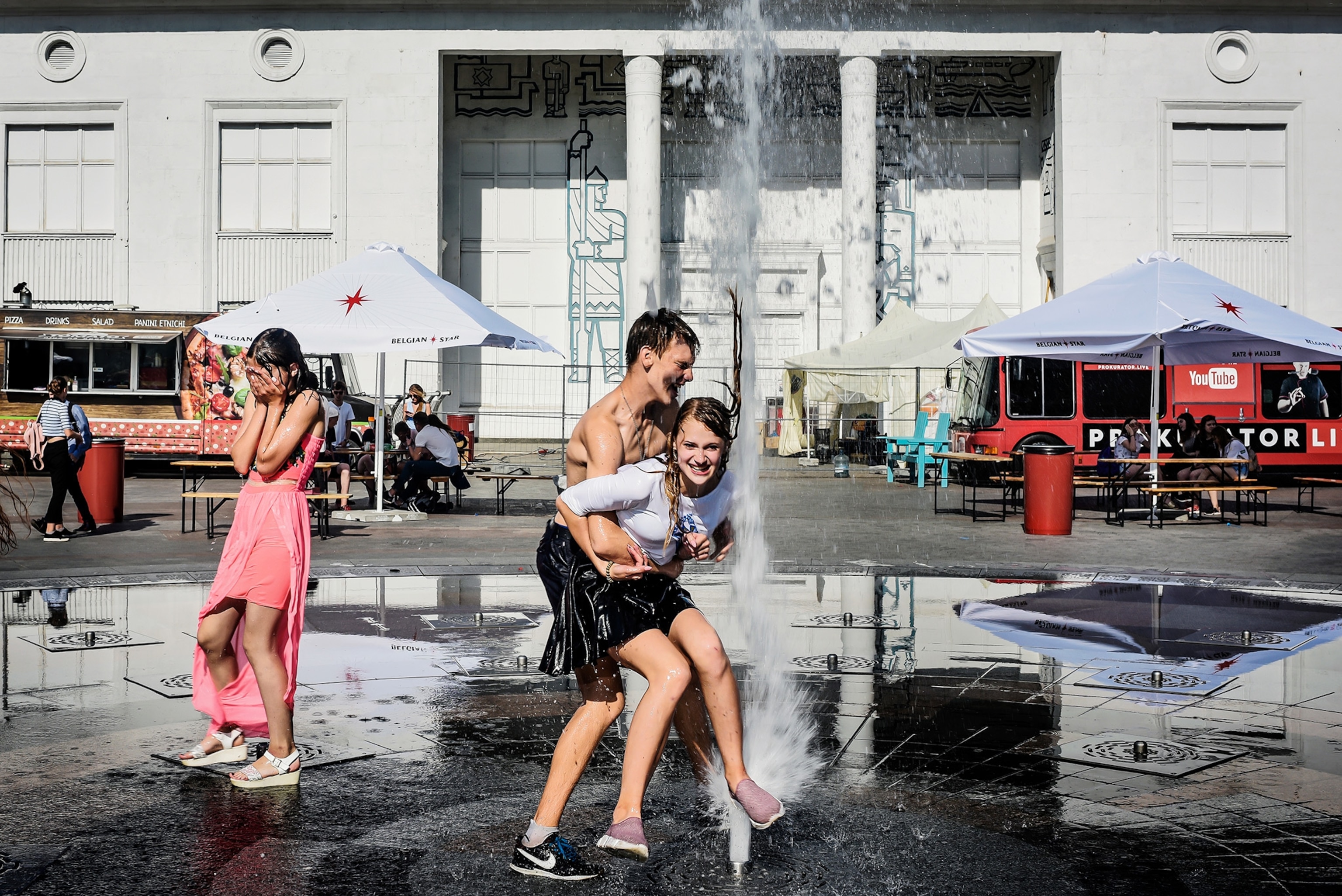 kids playing in fountains after the last day of school in Kiev, Ukraine