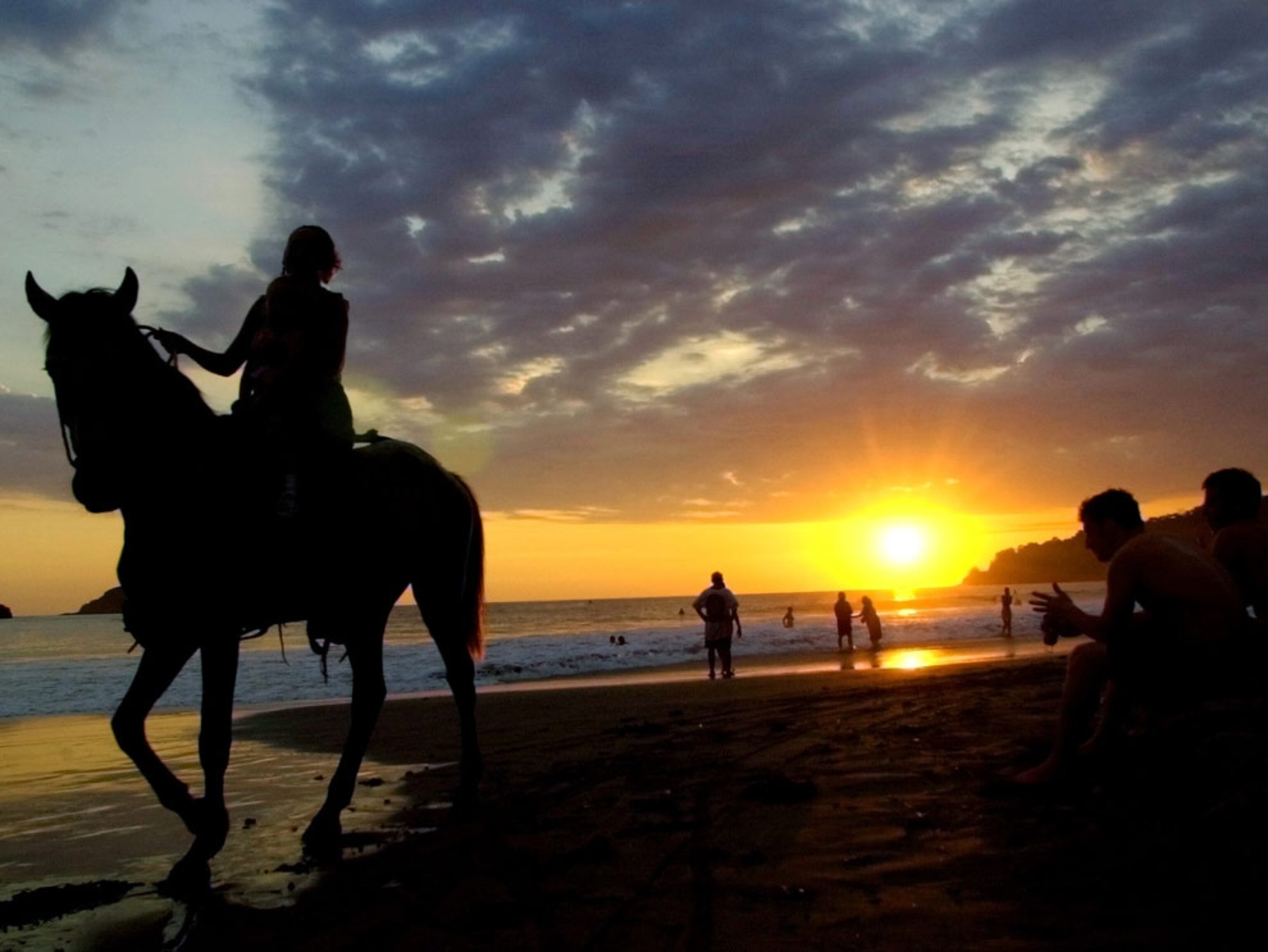Sunset horseback ride on beach