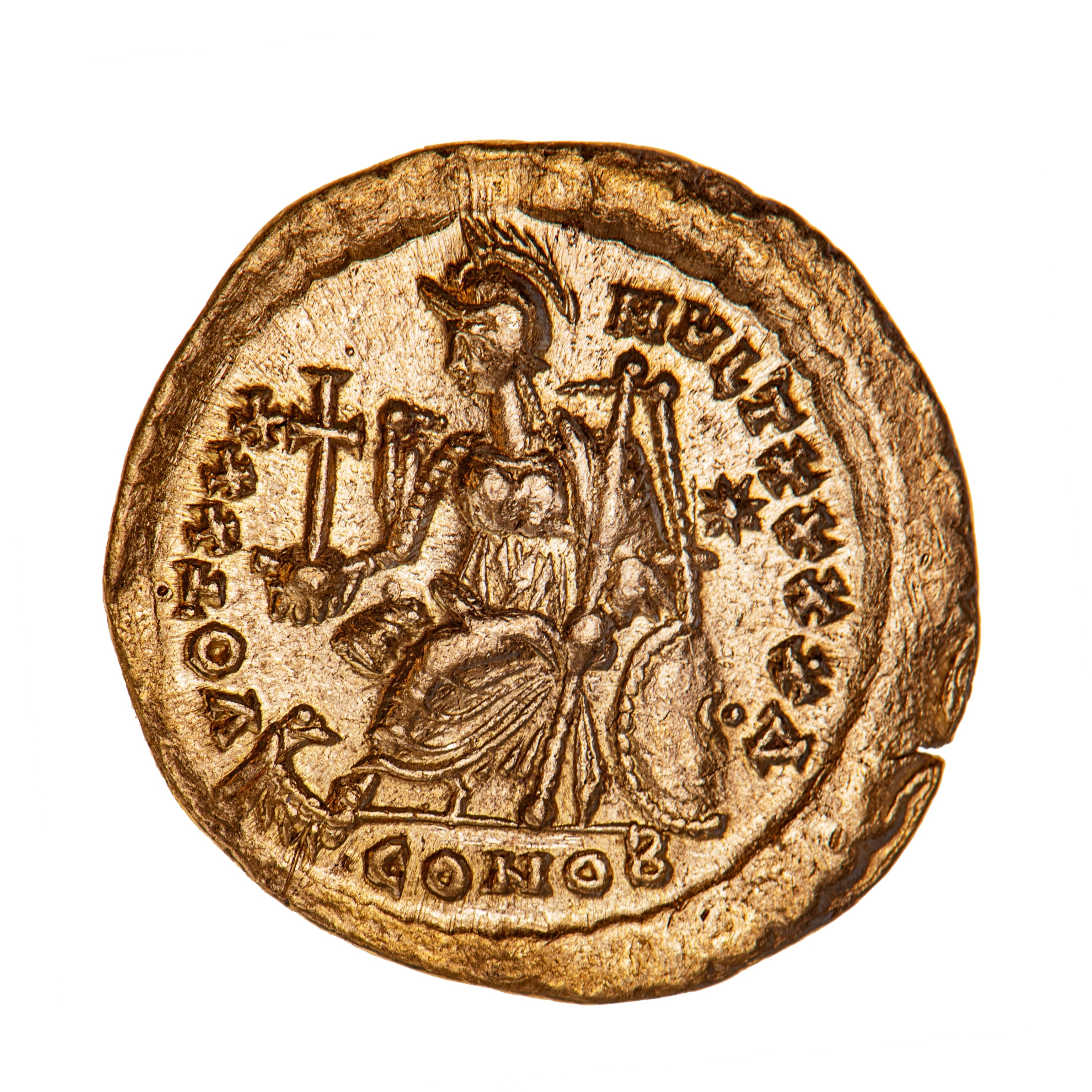 A round, gold coin with a stamped image of a person in a chair.