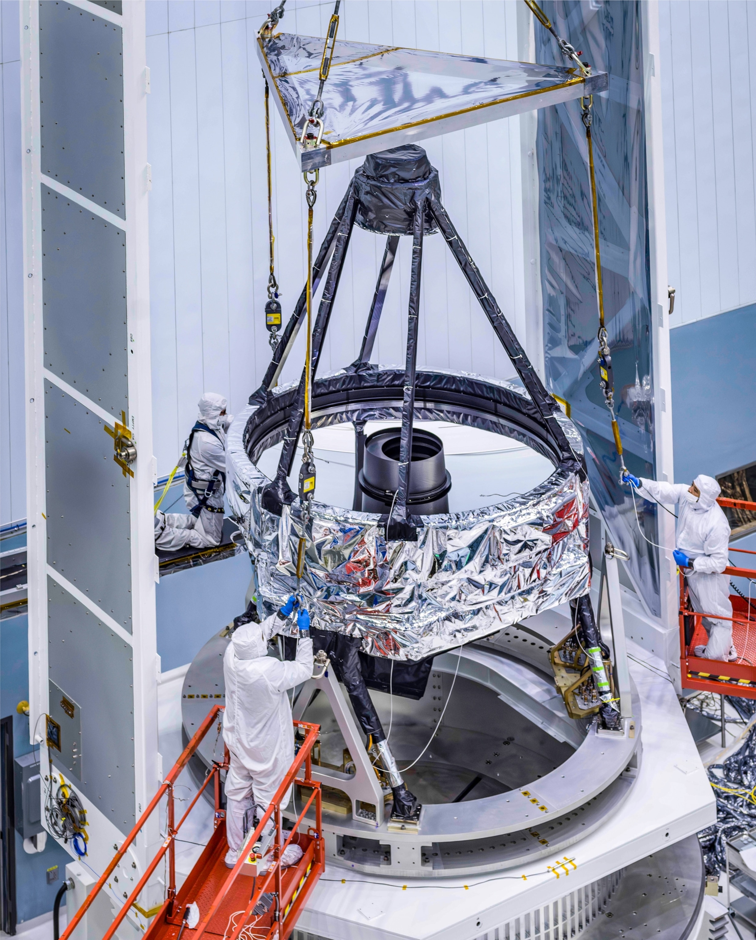 Telescope assembly team preps the lens for the Nancy Grace Roman telescope.