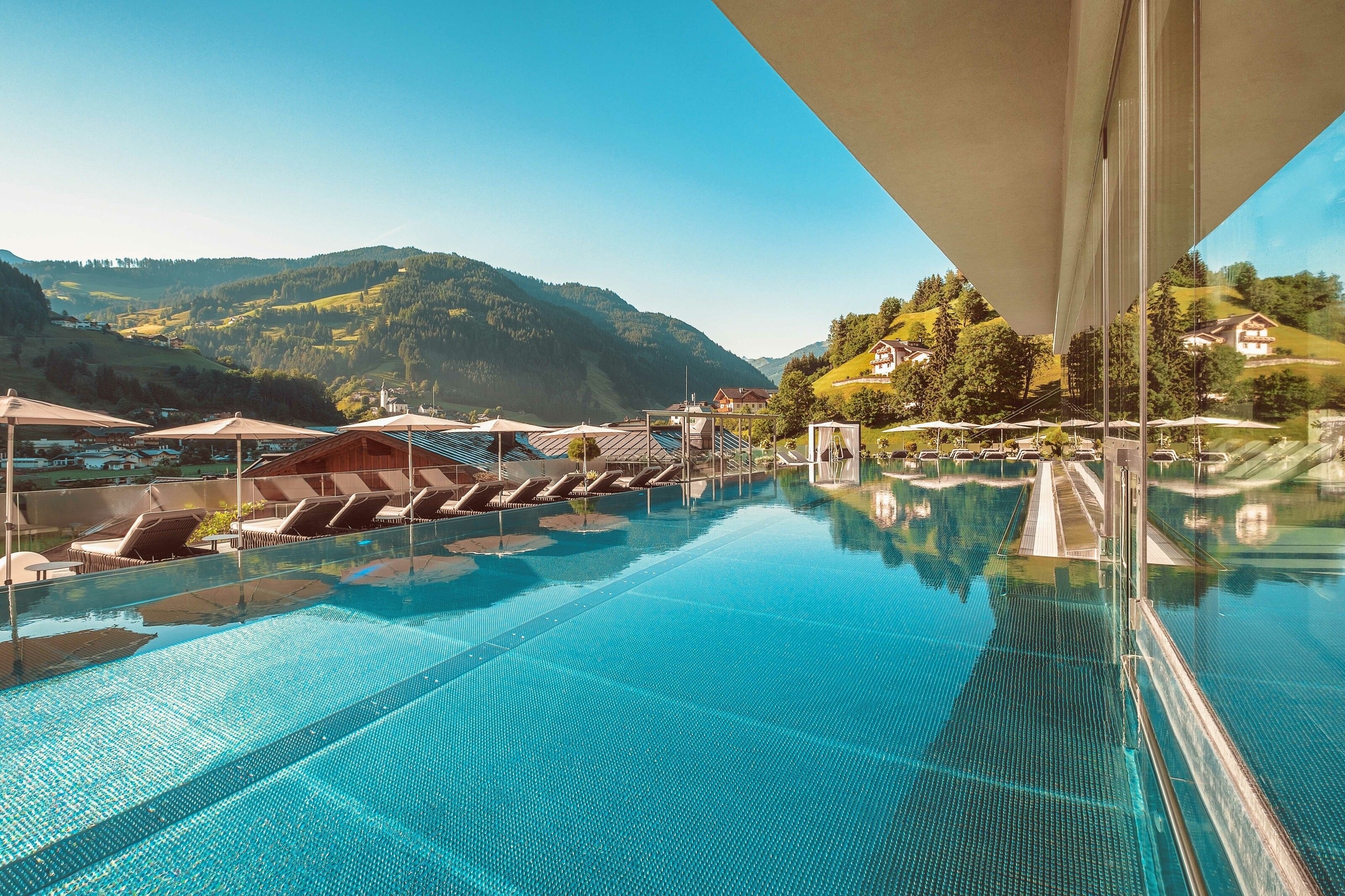 The outdoor pool at Das Edelweiss Salzburg Mountain Resort.