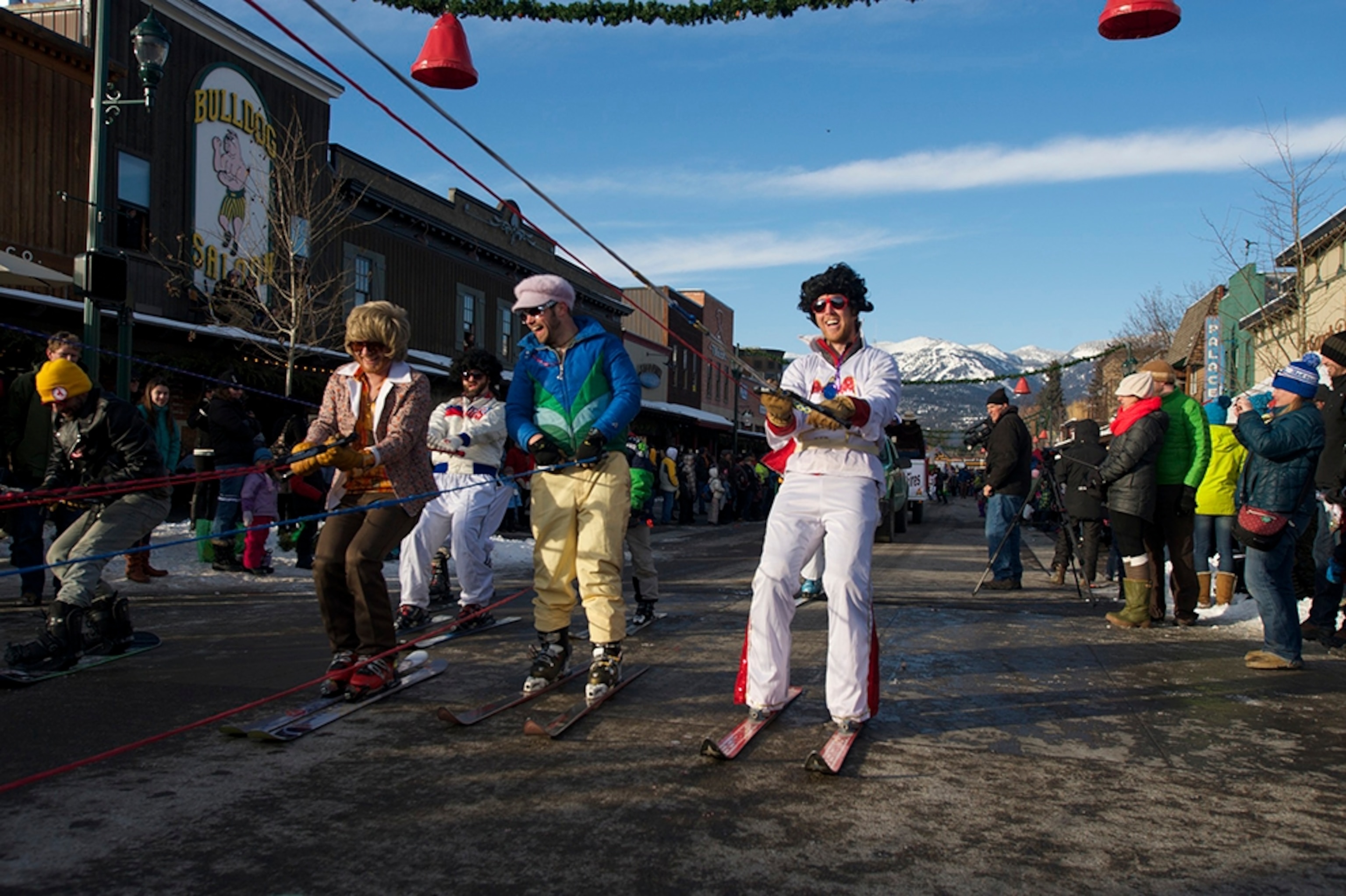 men skiing in the Whitefish Winter Carnival parade, Whitefish, Montana