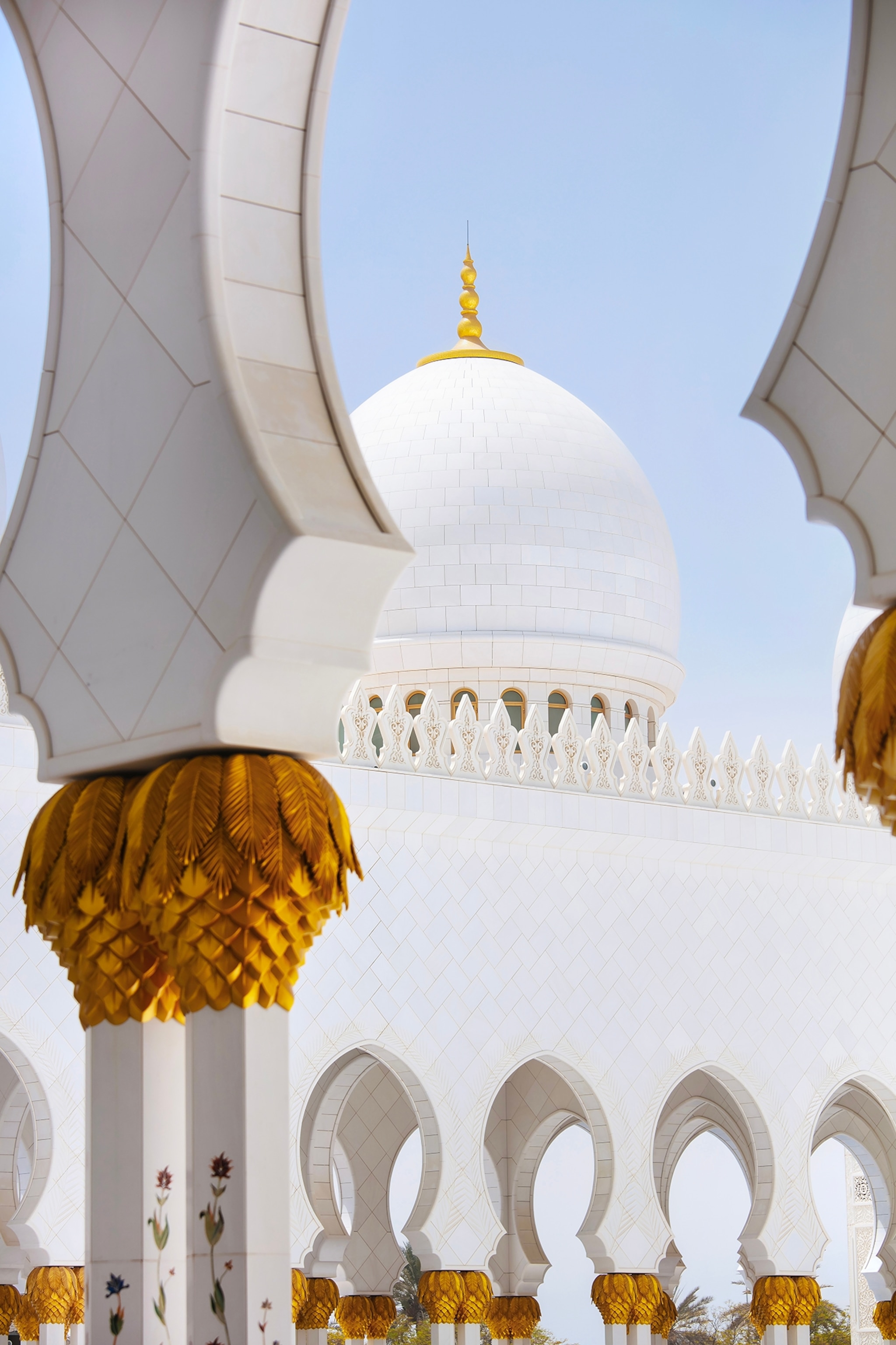 The Sheikh Zayed Grand Mosque Centre in Abu Dhabi is a masterpiece of light, symmetry, and silence. Photographing it felt like stepping into a dream made of white marble and perfect geometry, with every line, dome, and reflection designed to capture purity. The 82 domes rise like soft clouds above the courtyard, their curves blending seamlessly with endless arcades of polished marble. The play of light and shadow shifts throughout the day, turning stone into something almost weightless. The stillness, the symmetry, the brilliance of white meeting the blue desert sky…It’s one of the most peaceful and visually pure places I’ve ever photographed.