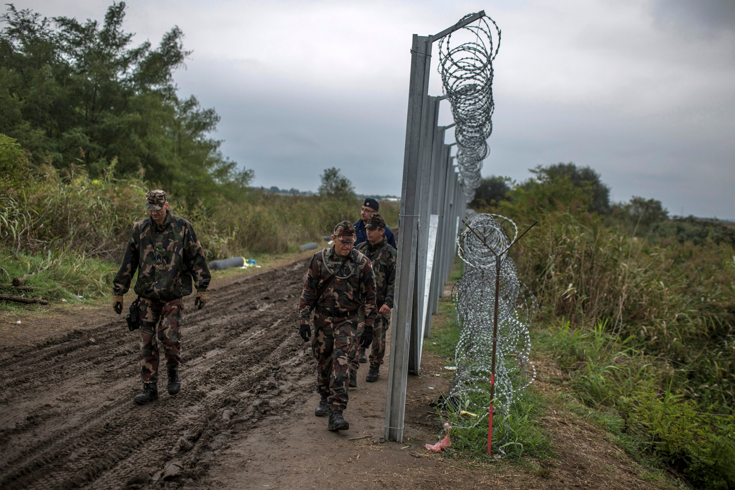 A Hungarian military patrol along the newly constructed border fence with Serbia