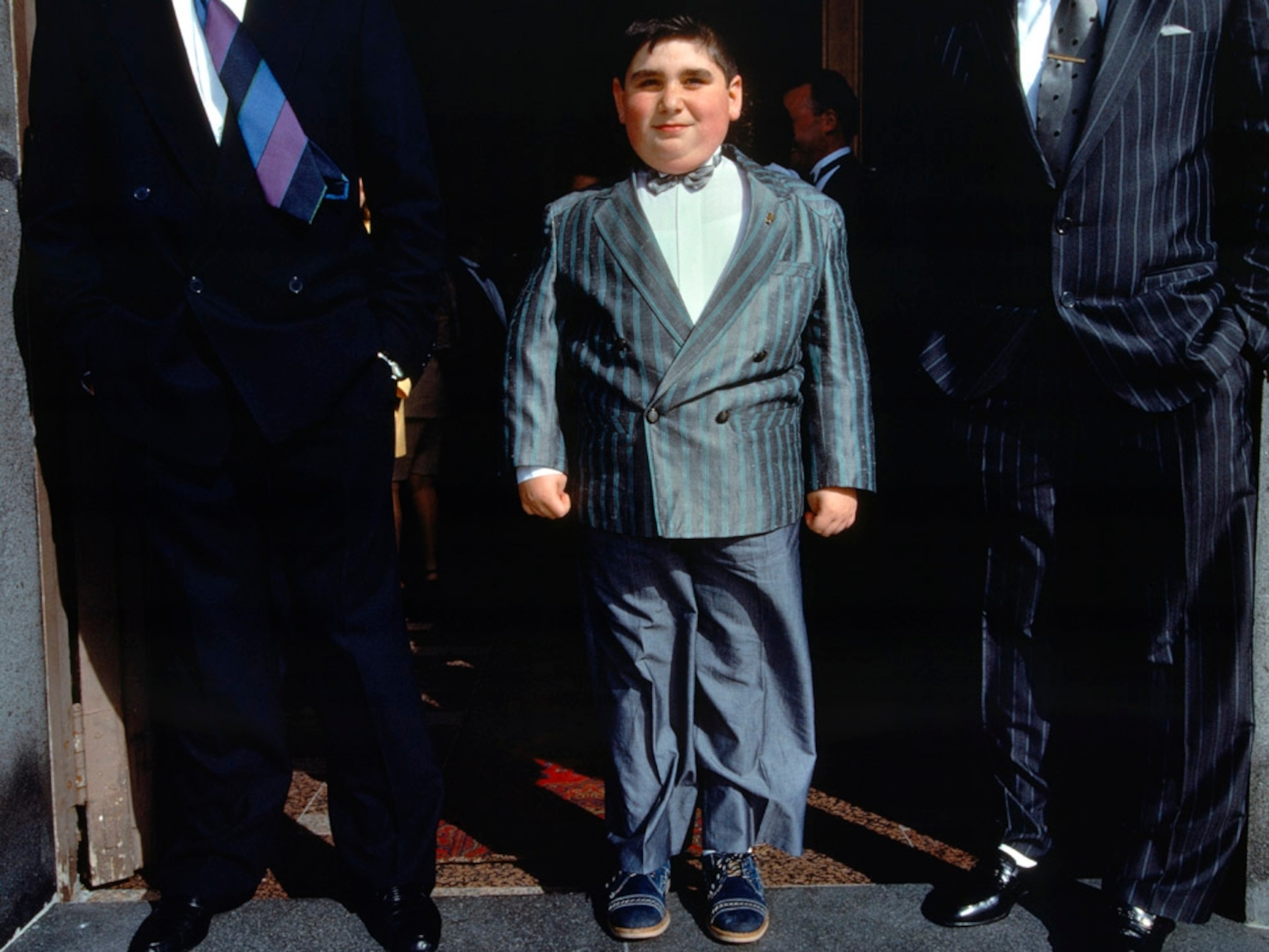 Two men and a boy outside a wedding in Sciacca