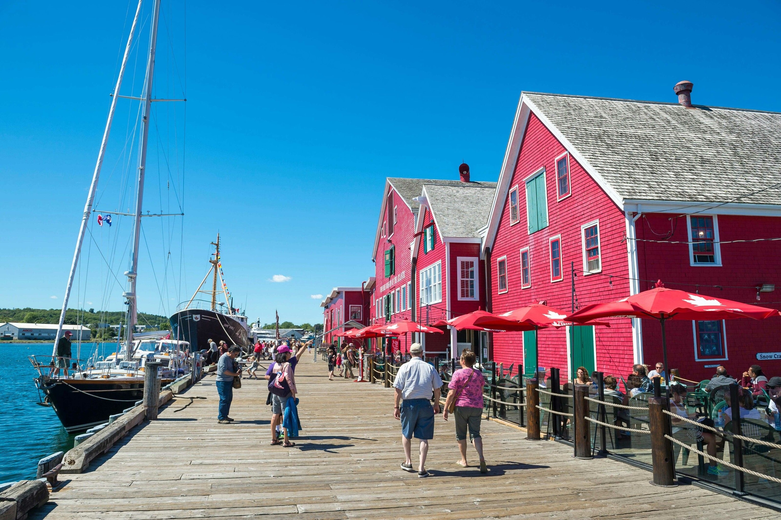 Pink buildings line the water the port town of Lunenburg.