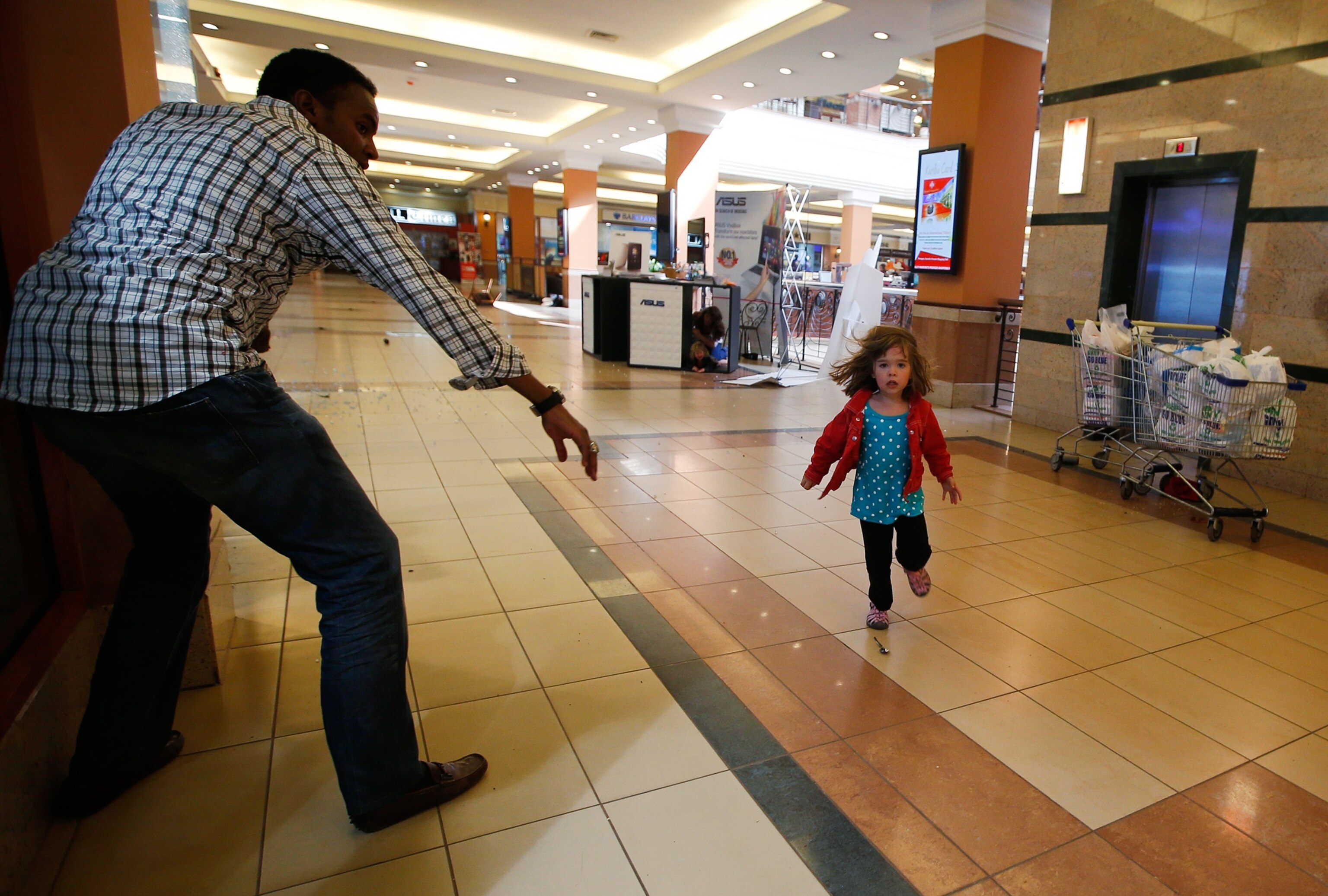 a child running to safety at the Westgate Mall in Nairobi, Kenya