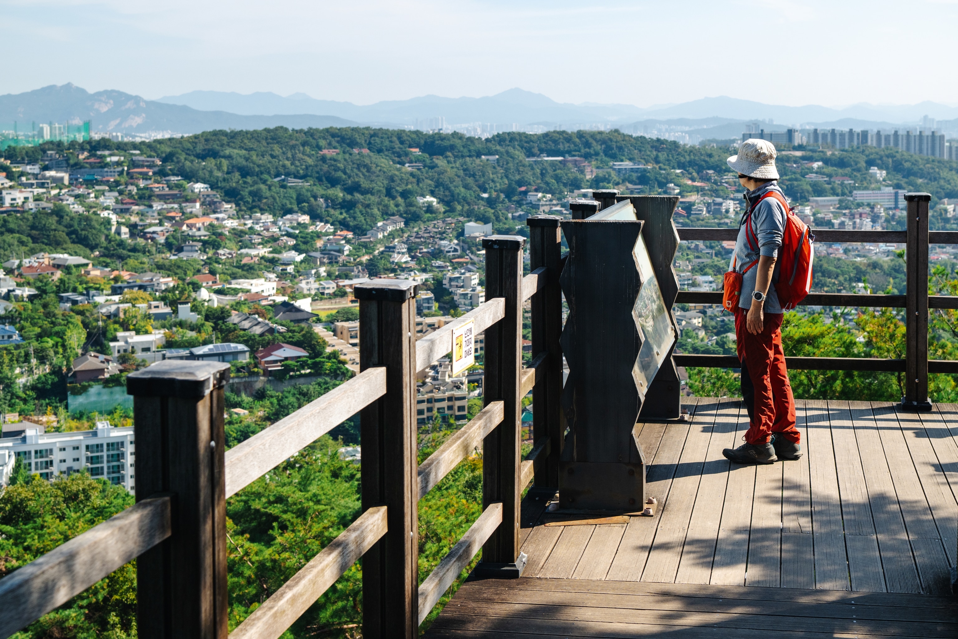 Walker on a lookout point of a mountain