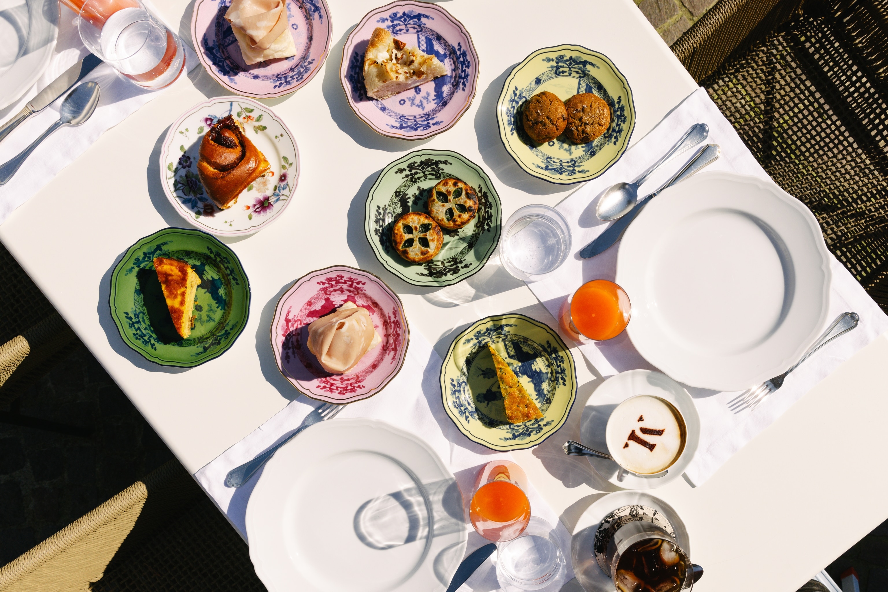 A set table shot from above with lots of small plates.