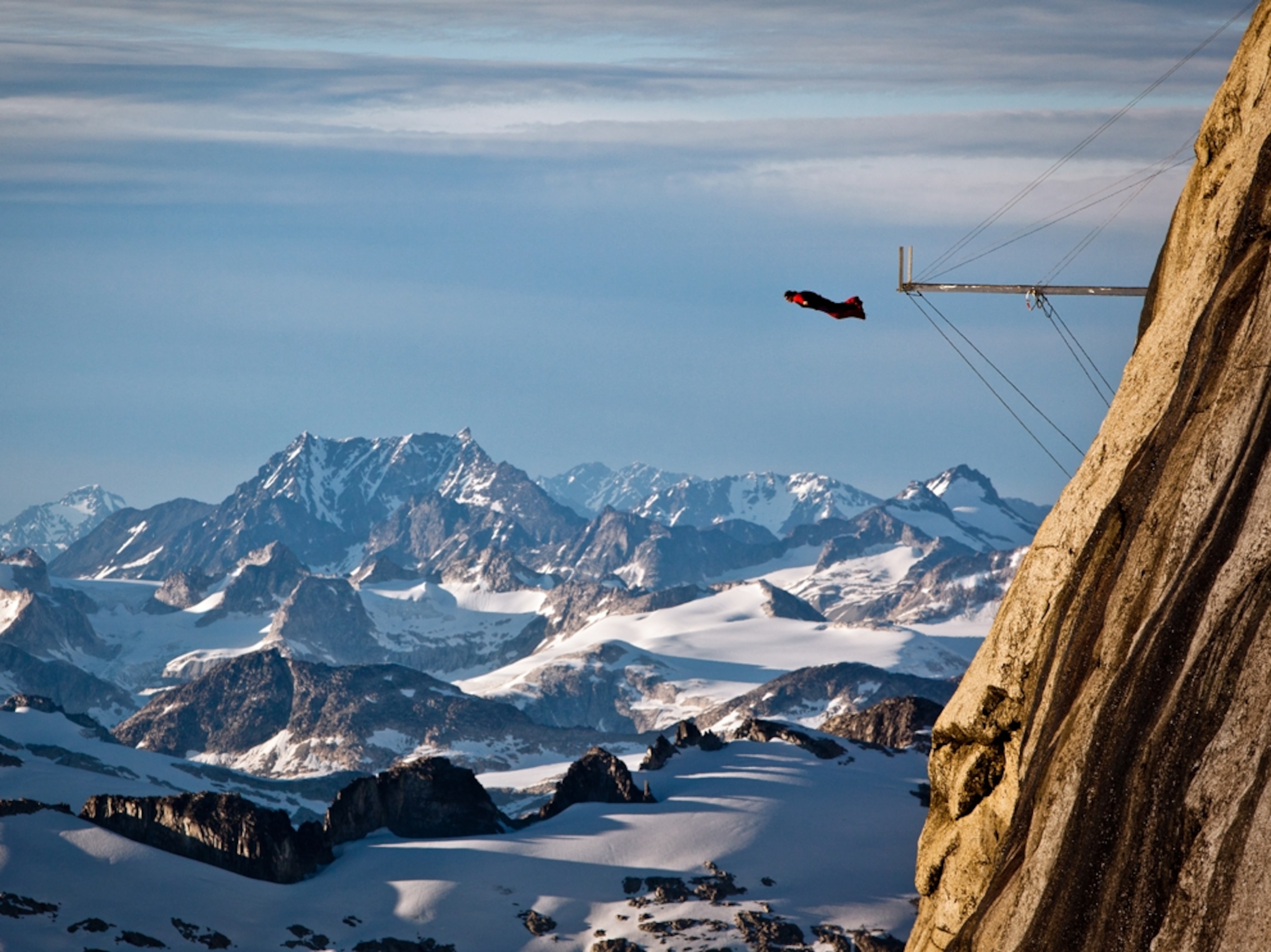 Dean Potter BASE jumps from Mt. Butte in Canada.