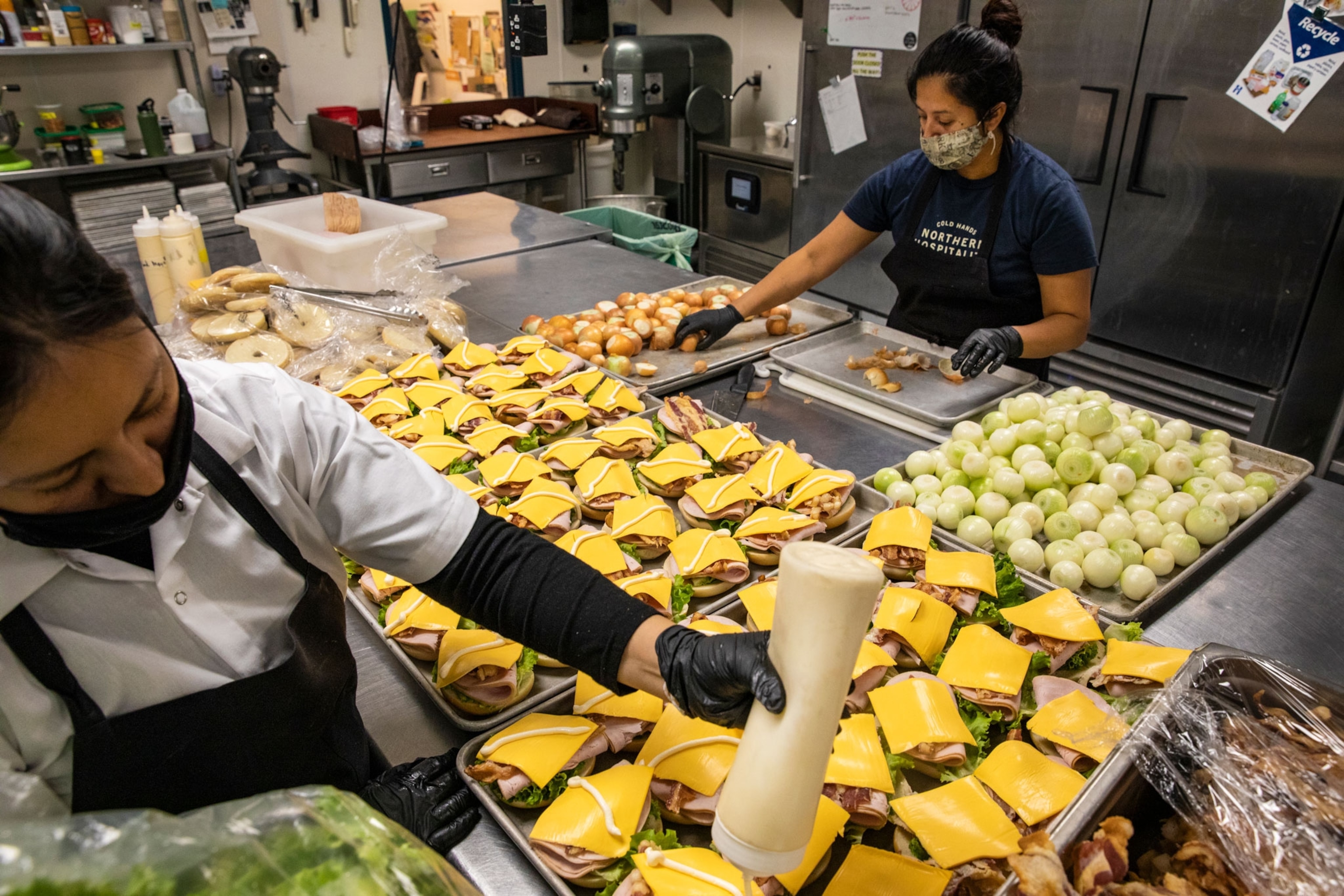 Women prepare food for people in need.