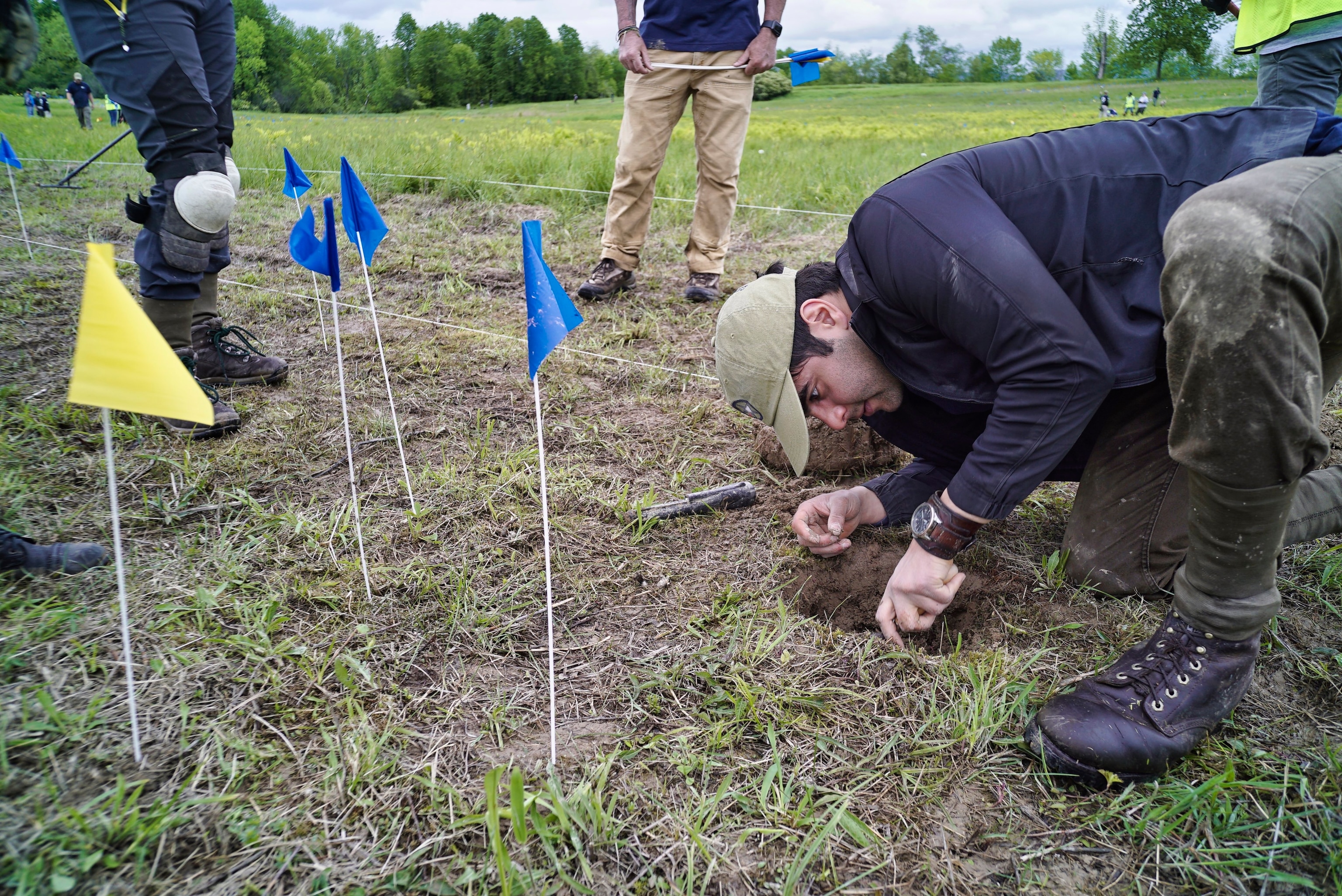 Army veteran Zeth Lujan from Rochester, N.Y., digs into a spot to find an artifact during an archaeological survey of the Barber's wheat field at the Saratoga National Historical Park, in Stillwater, N.Y. Veterans with American Veterans Archaeological Recovery (AVAR) along with students from Sacred Heart University and National Park Service staff are taking part in the dig to find artifacts. Barber's wheat field was the site of the second battle of Saratoga that took place on Oct. 7, 1777.