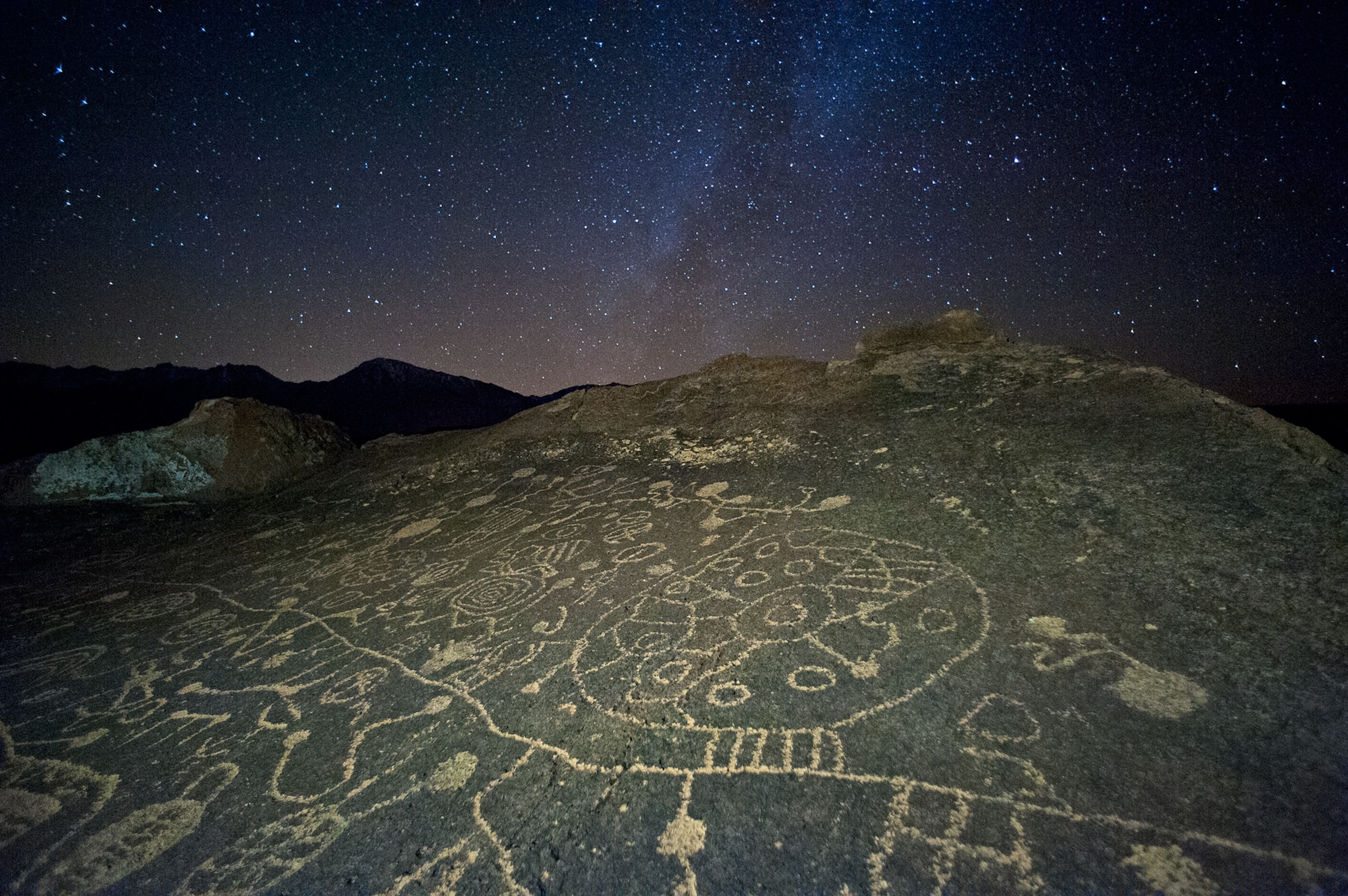 Petroglyph picture - Native American rock art photographed against the Milky Way