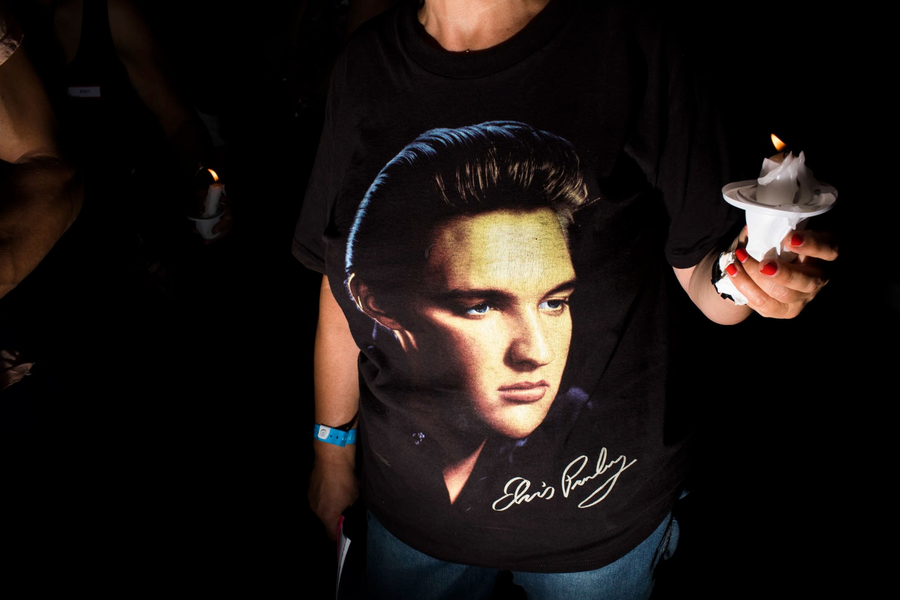 a woman wearing an Elvis shirt