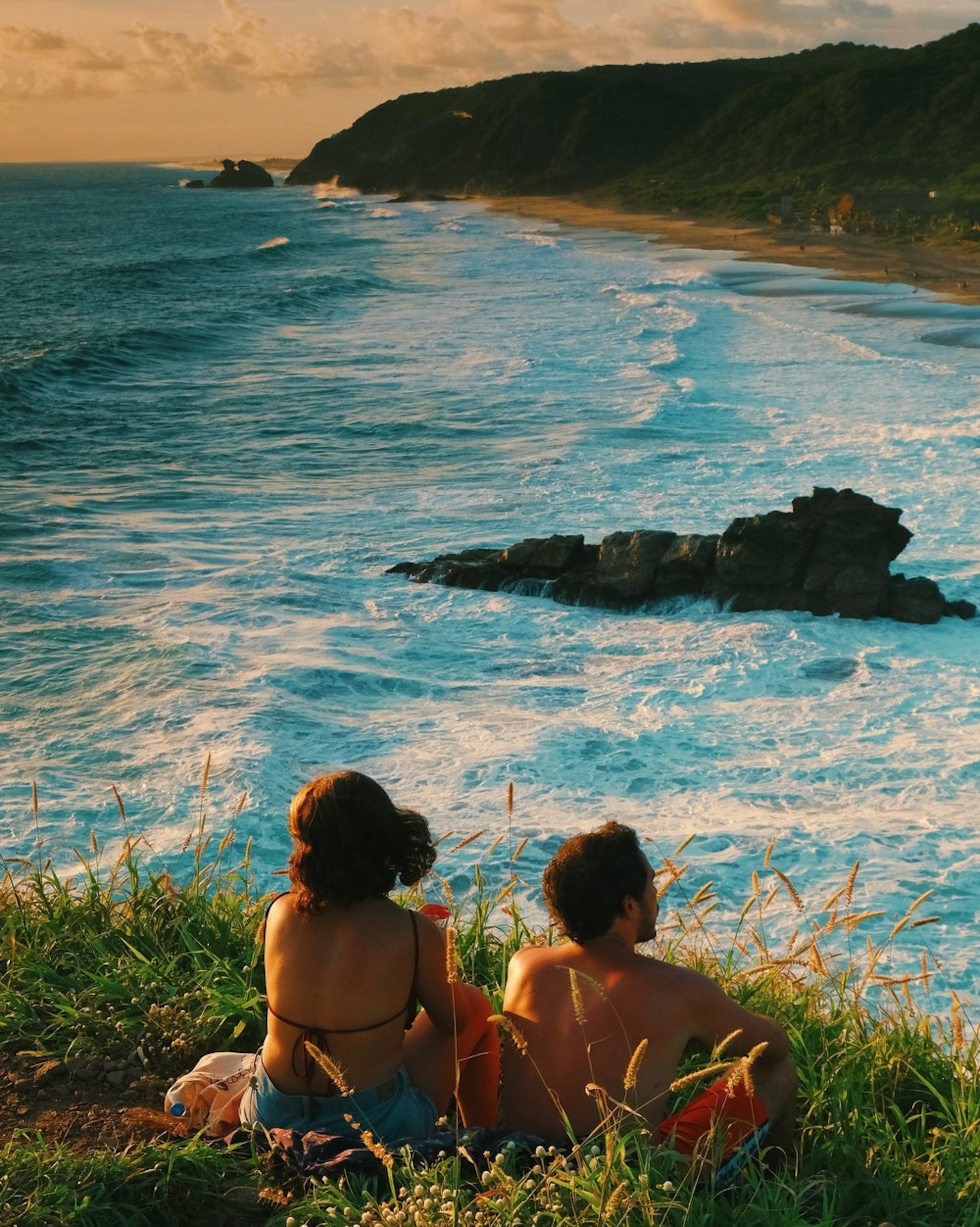 A couple at sunset at the Punta Cometa viewpoint, the southernmost corner in the state of Oaxaca.