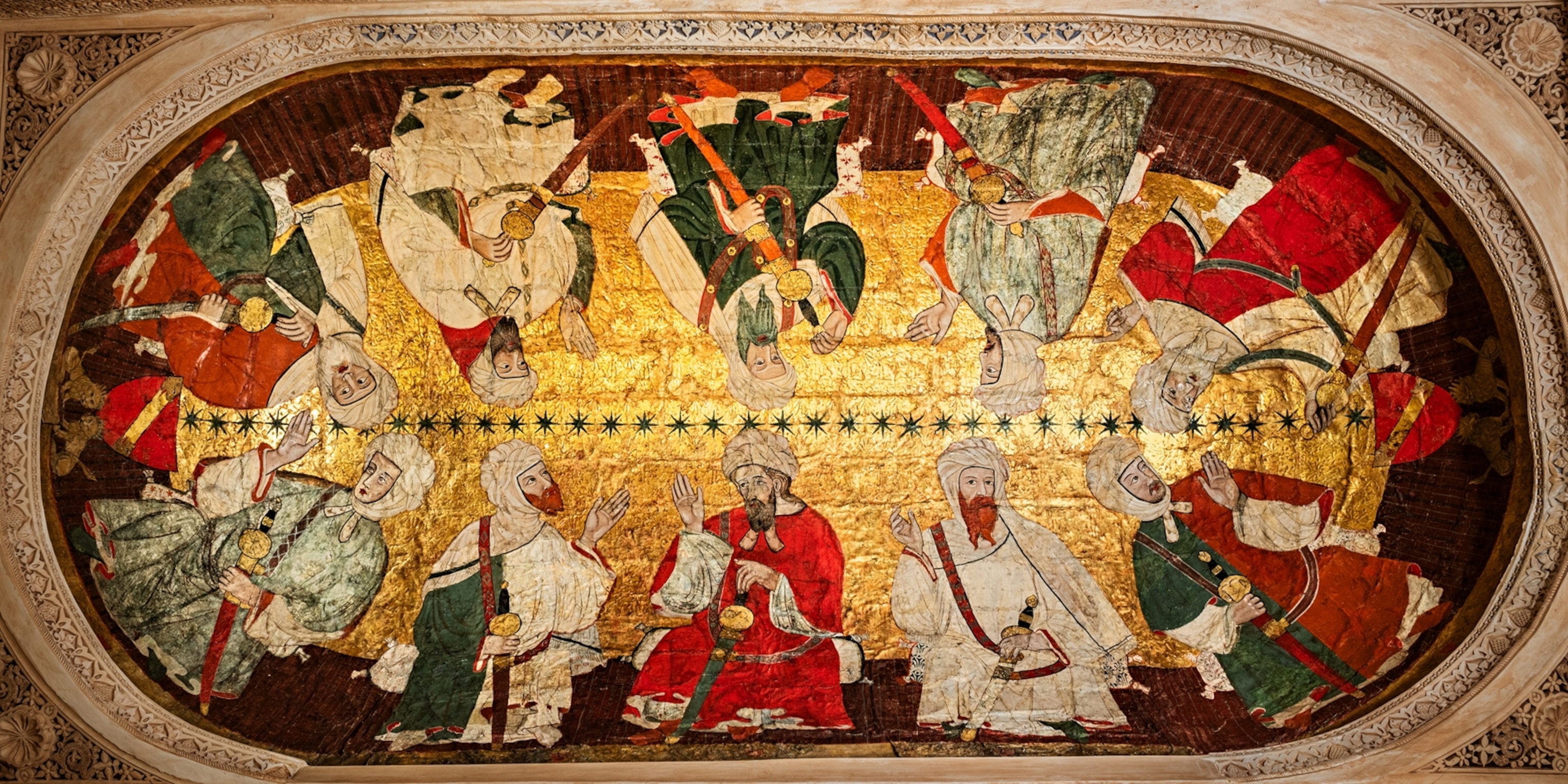 Oval ceiling painting depicting ten men in colorful clothes on background of gold.