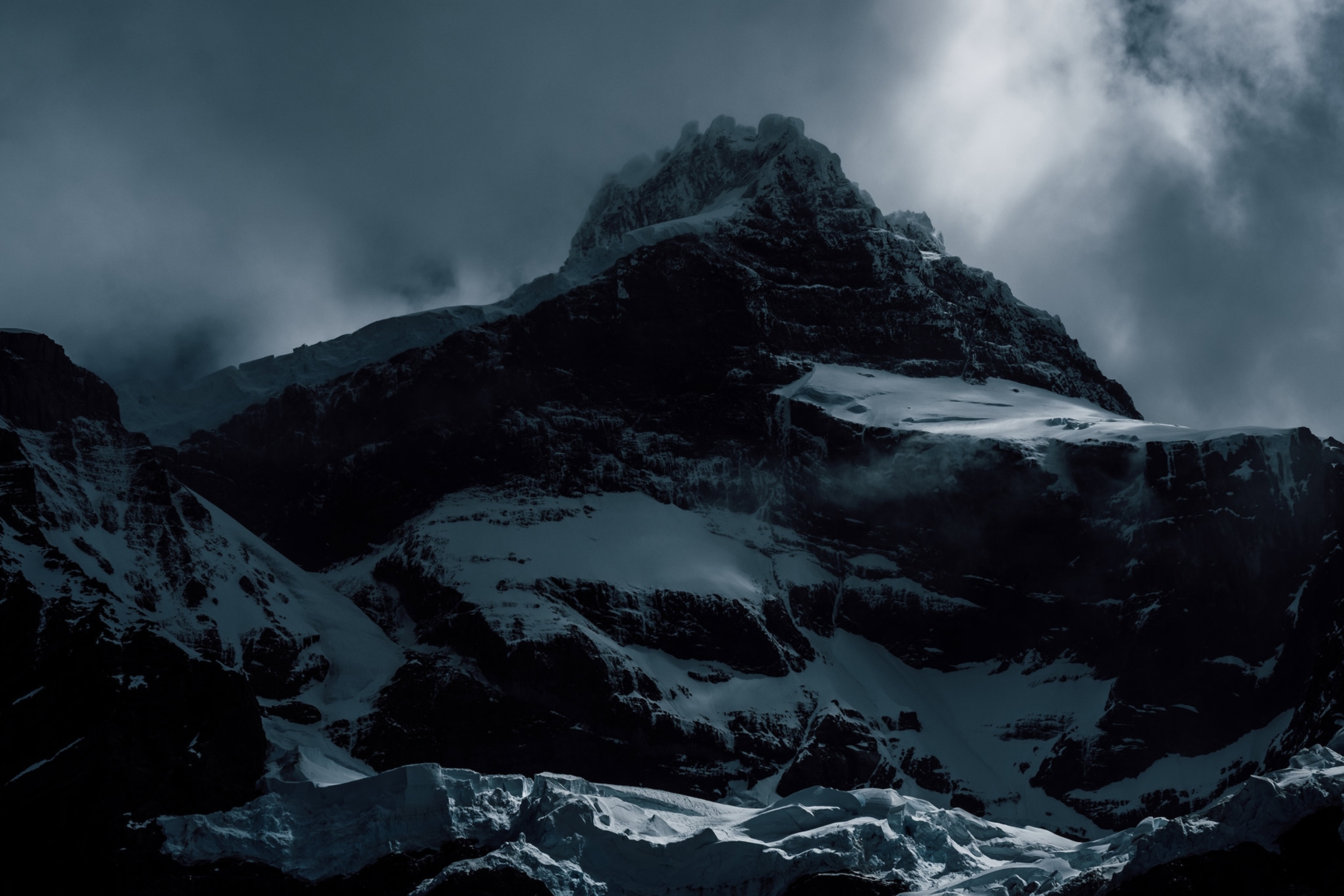 dark clouds over a mountain in Torres del Paine National Park, Chile