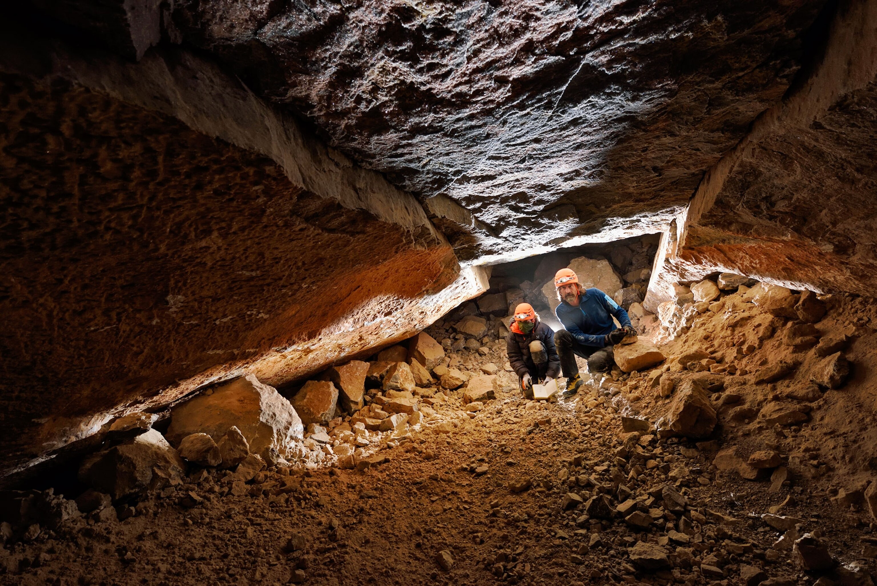 people exploring a cave