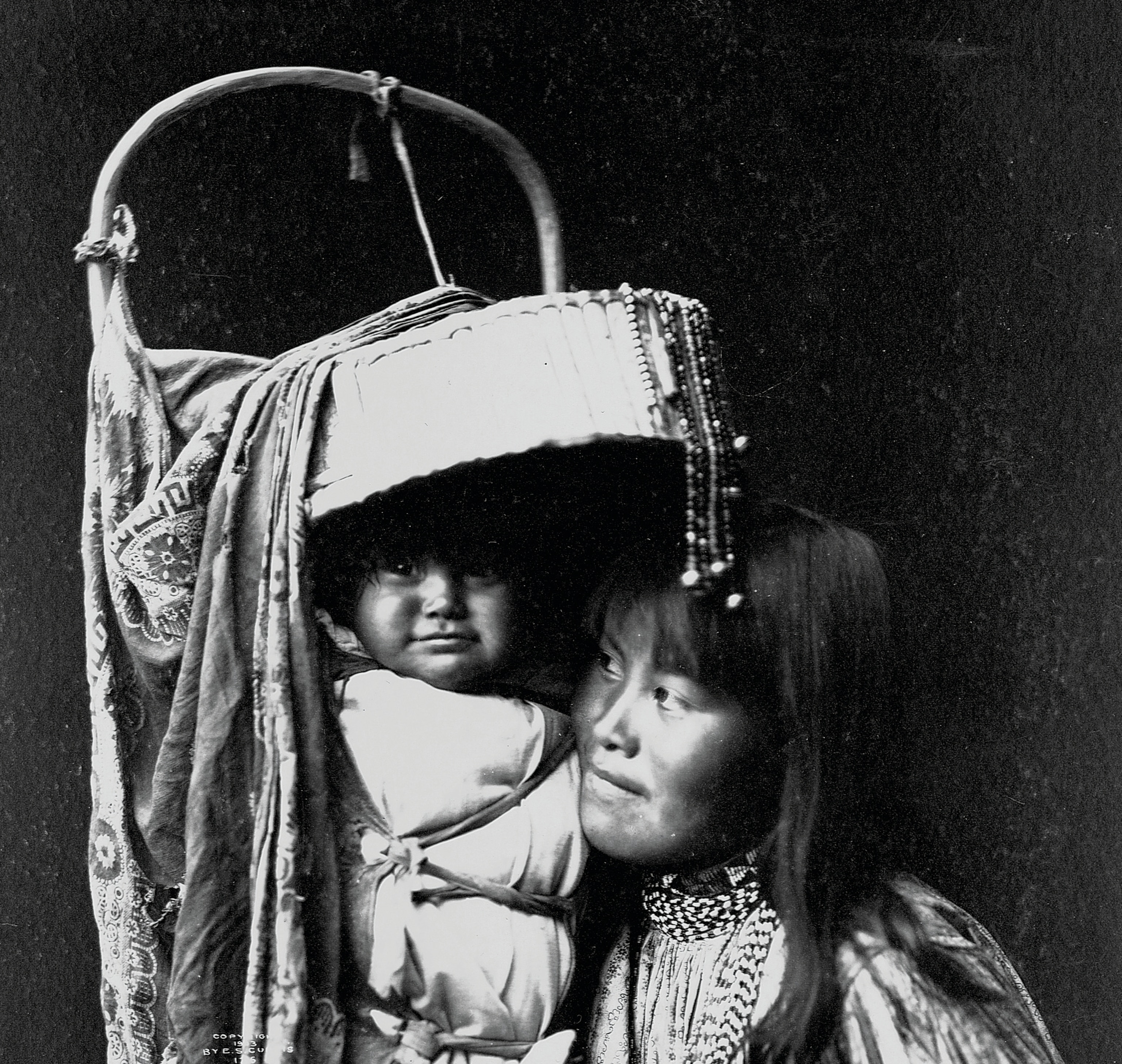 An Apache girl and a baby are pictured.