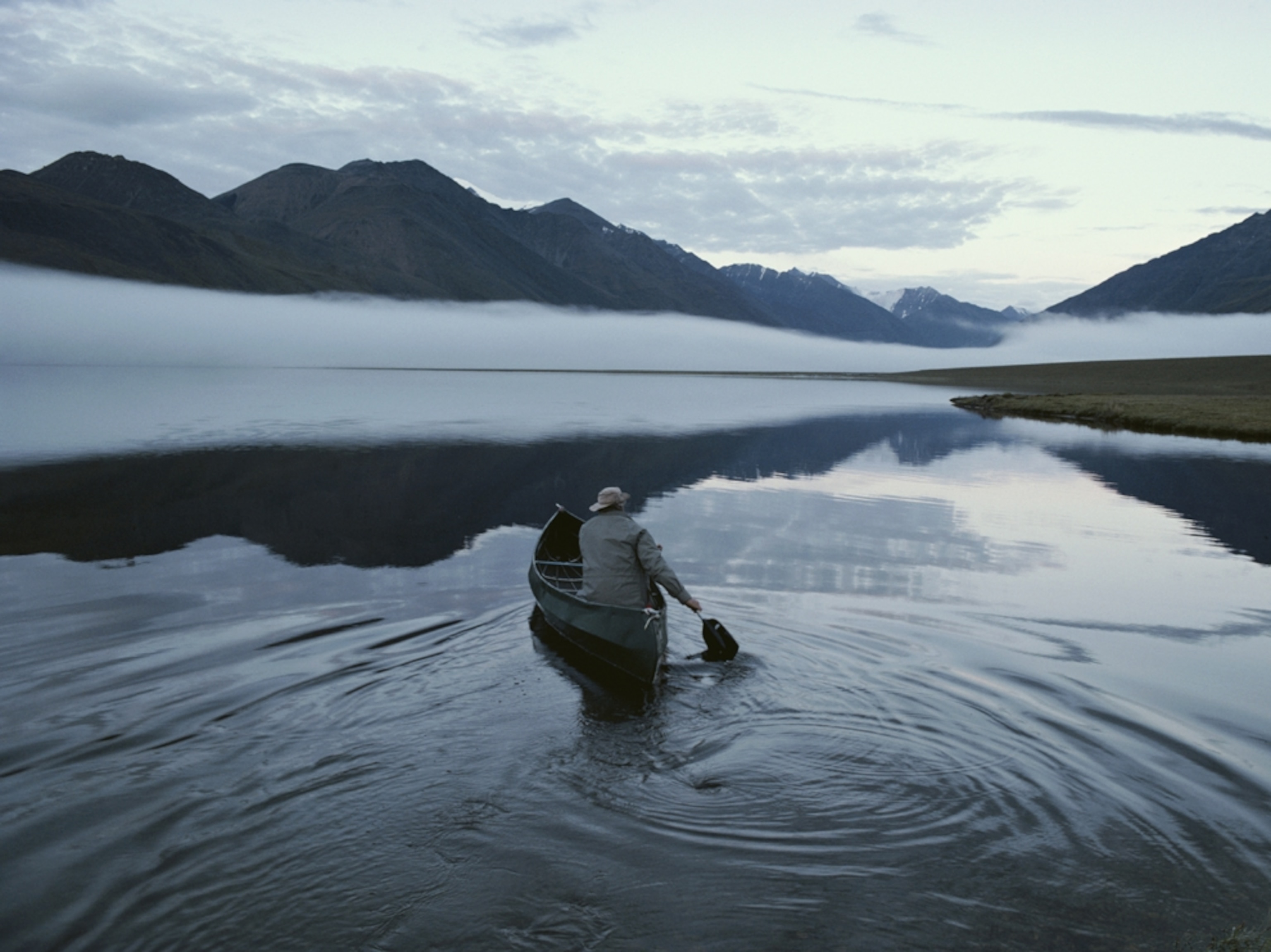 man paddling canoe on Lake Schrader