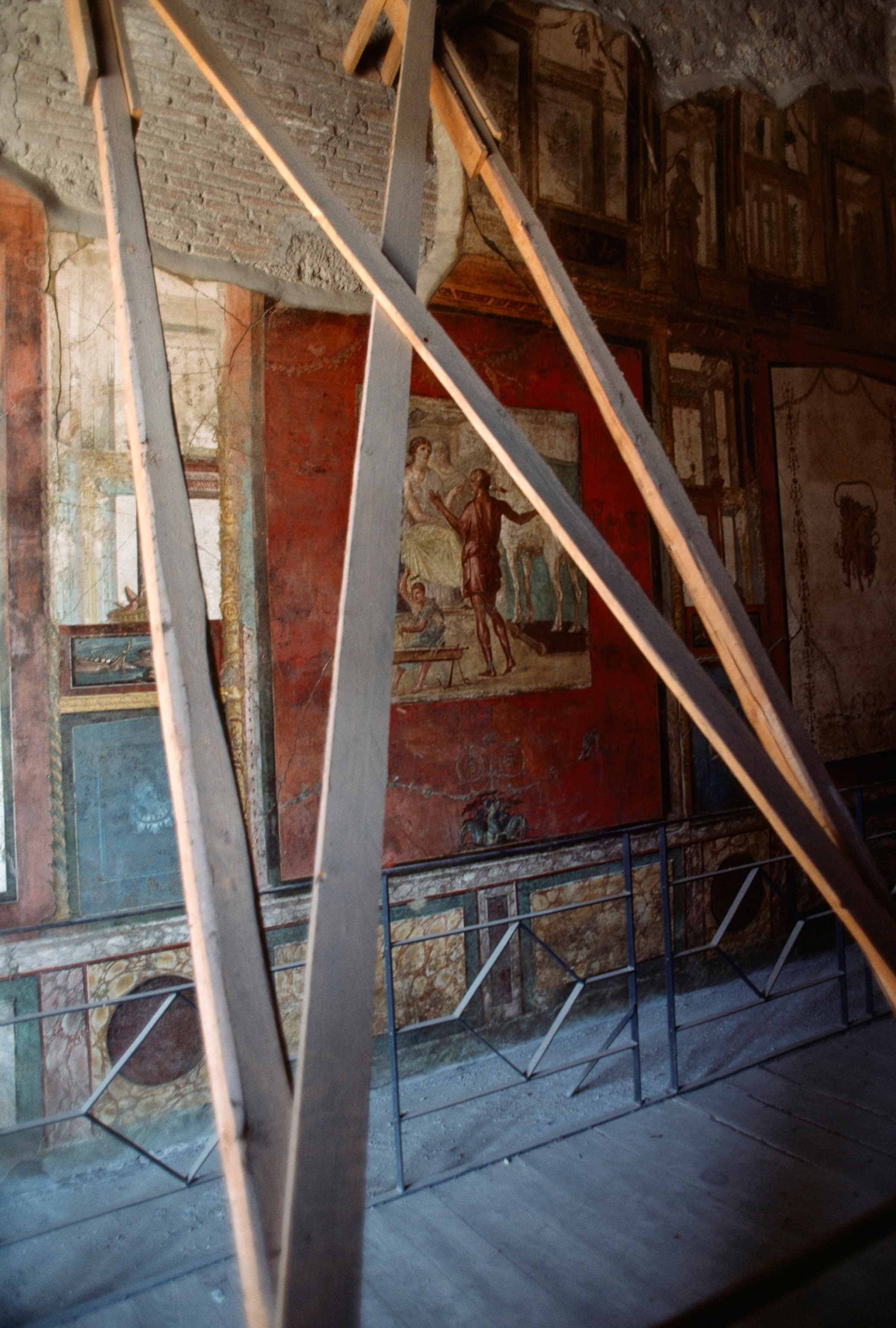 Wooden beams brace walls damaged by a 1980 earthquake.