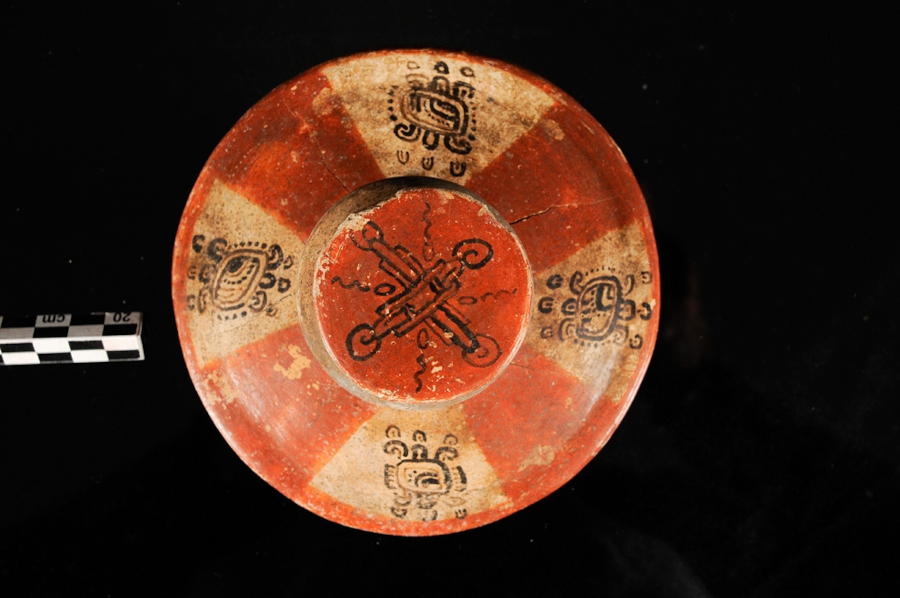 Maya lid with glyphs, from new royal tomb in Guatemala noted for its bowls of human fingers.