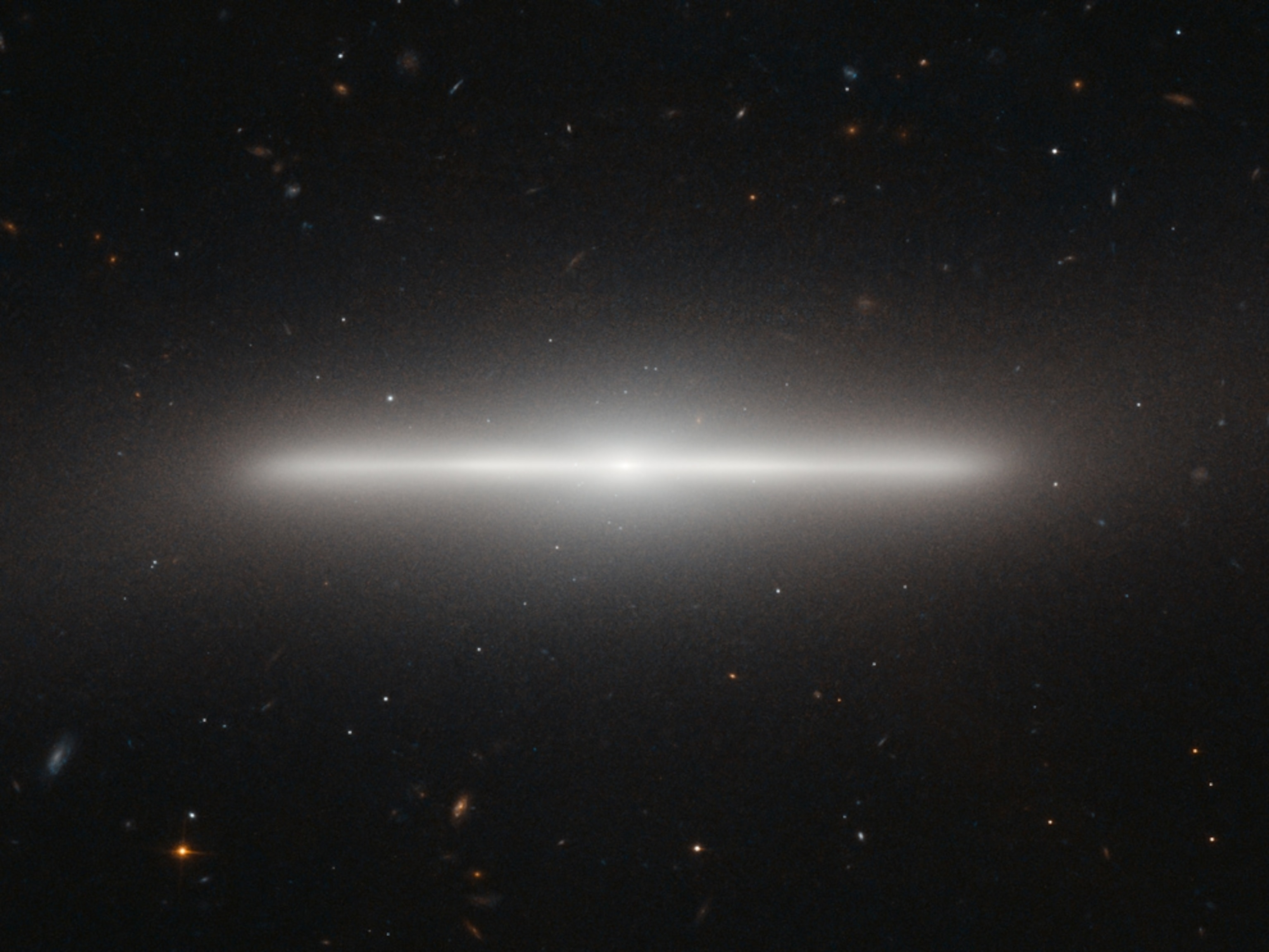 Picture of a slim galaxy seen edge-on.