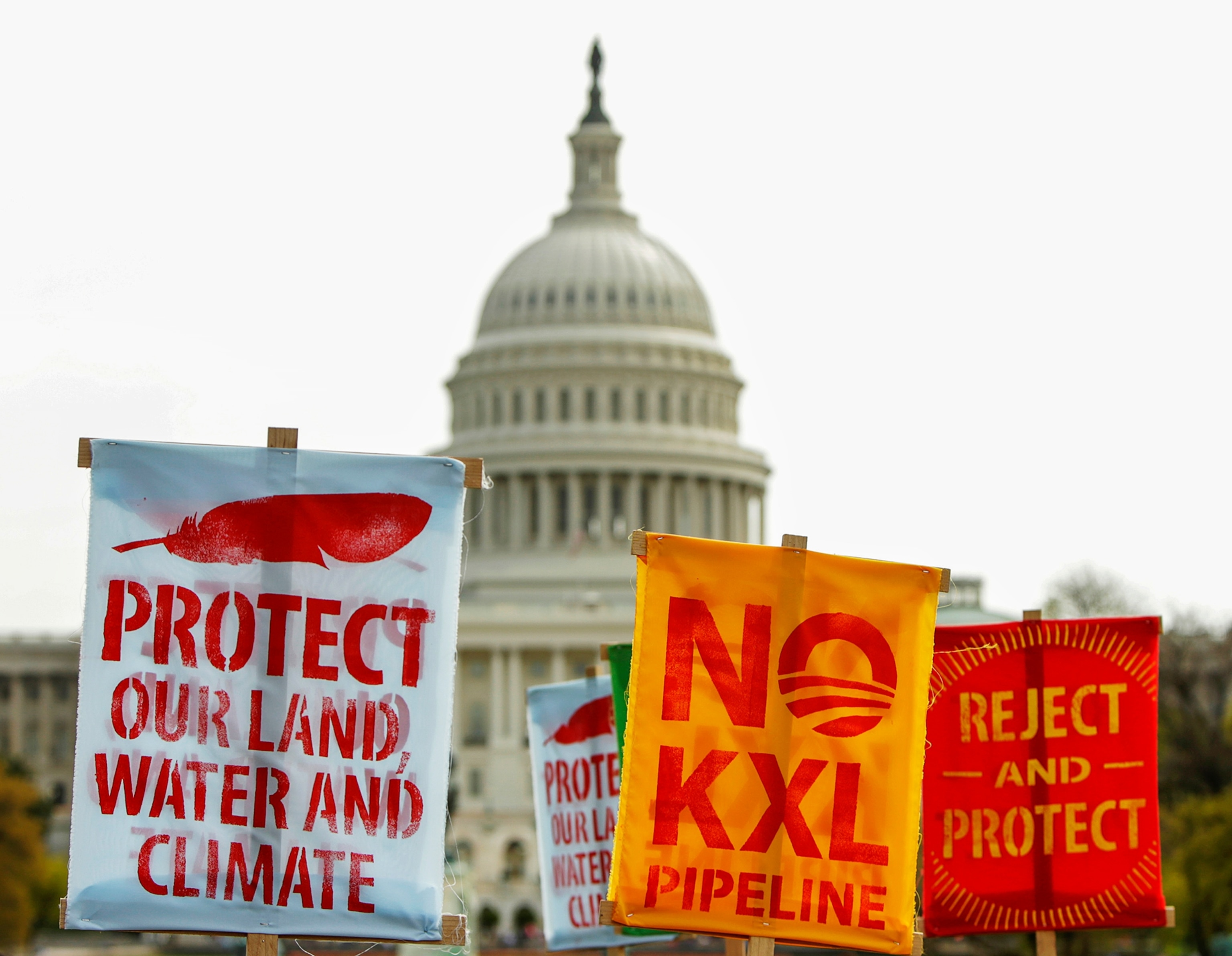 protestor's signs in front of the Capitol building.