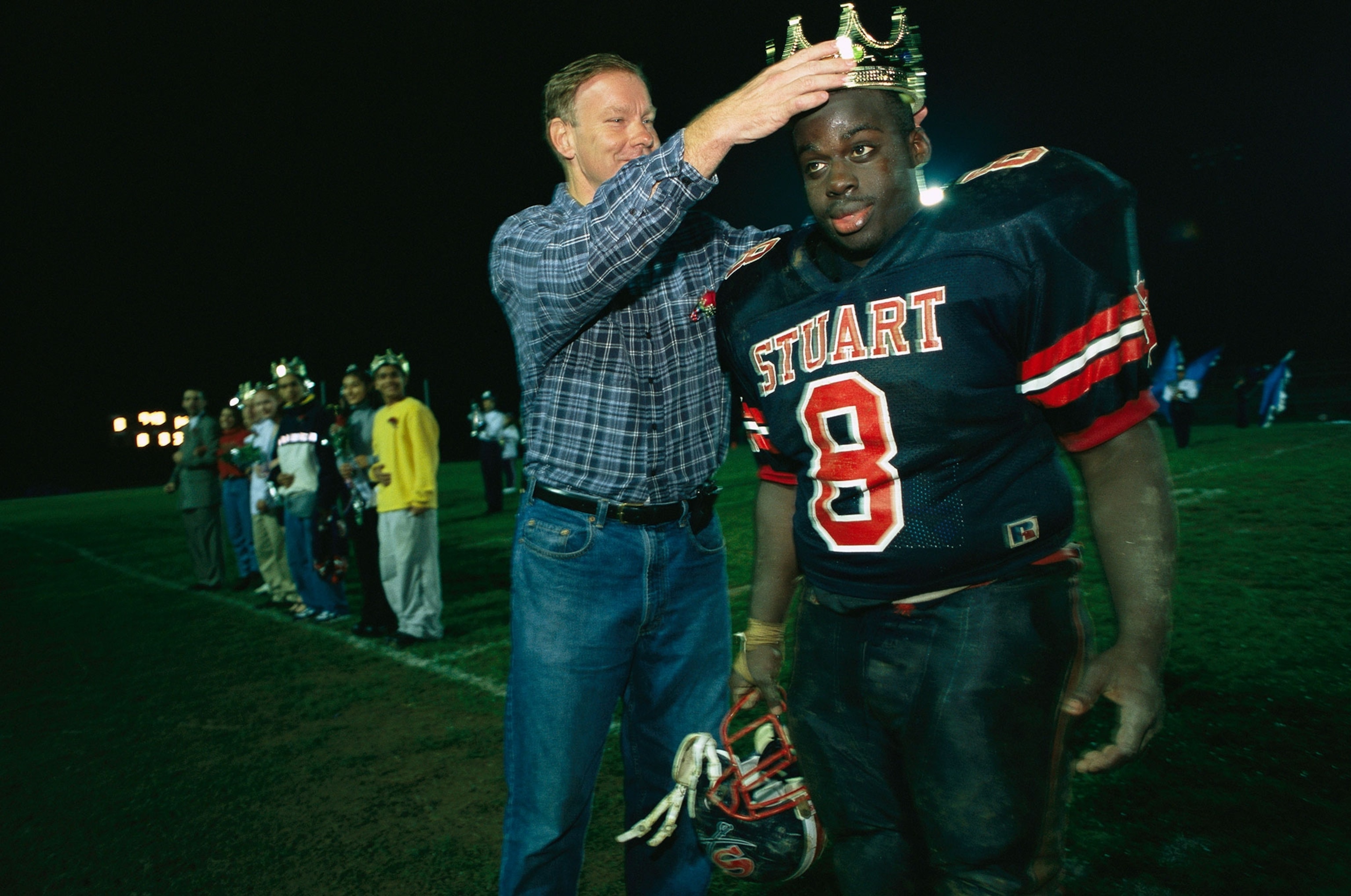 a local congressman Tom Davis crowning homecoming king Kevin Wiafe