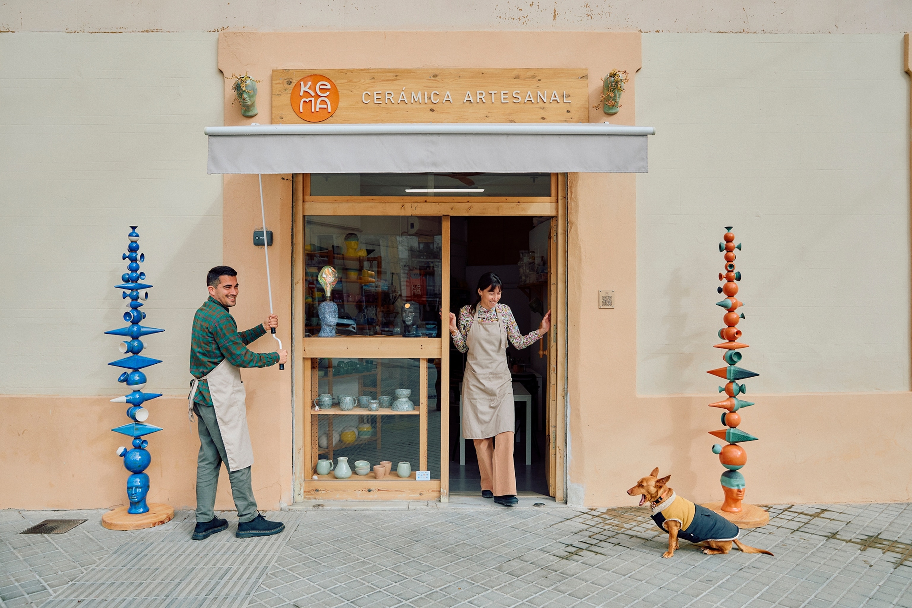 two people in front of a shop in Spain