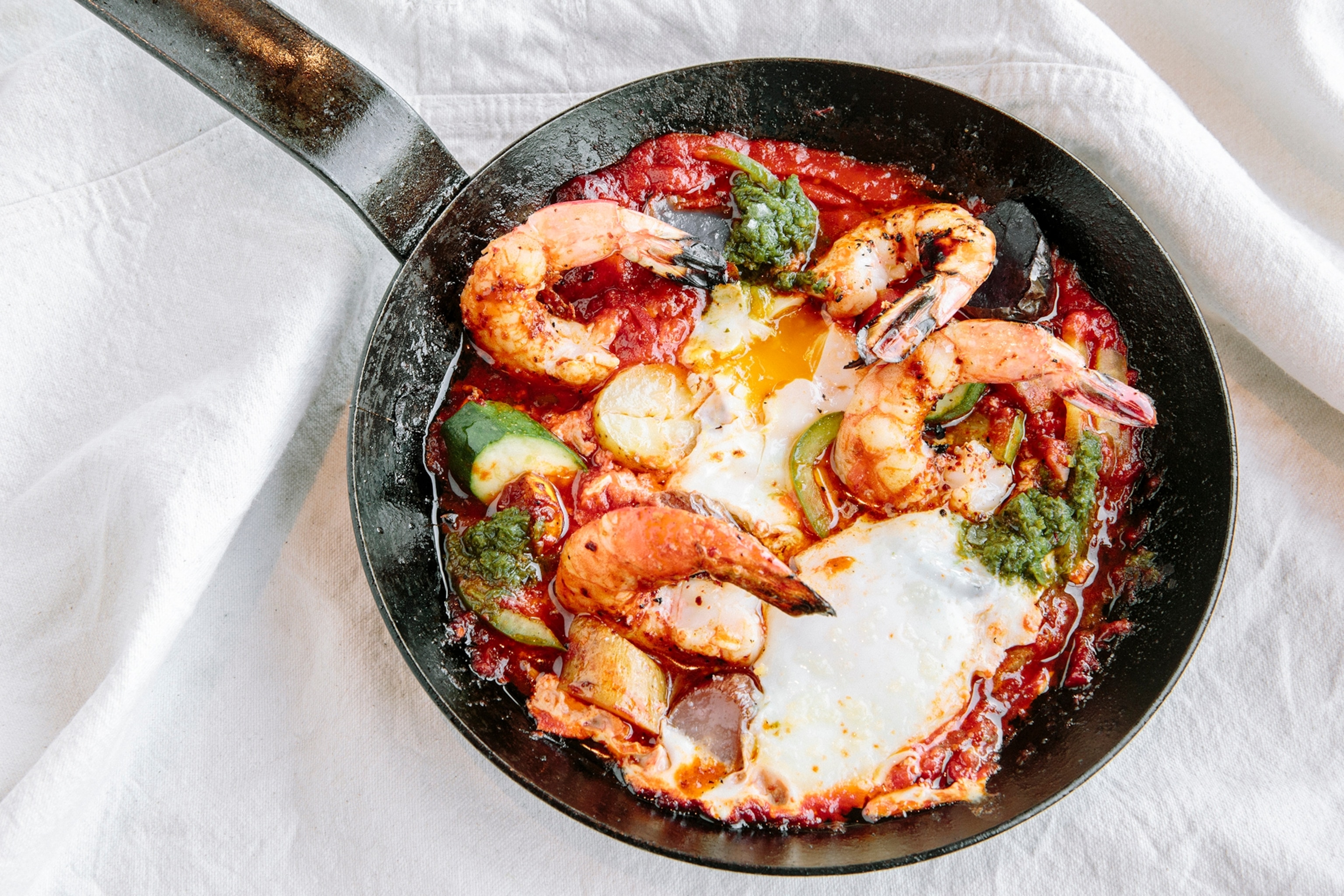 a pan of shrimp shakshuka from Shaya, a New Orleans restaurant