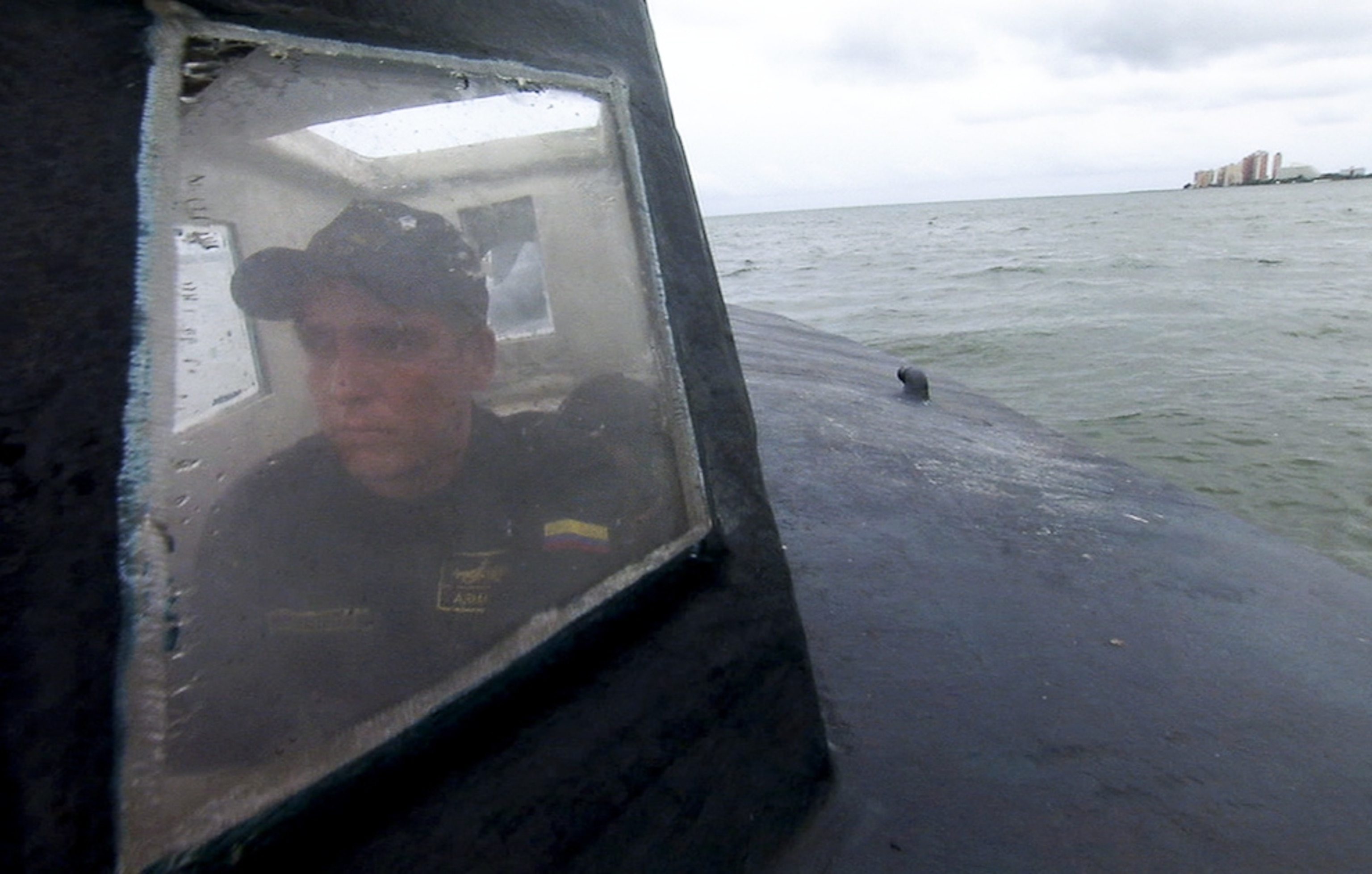 a Coast Guard member driving a semi-submersible cocaine sub in Colombia