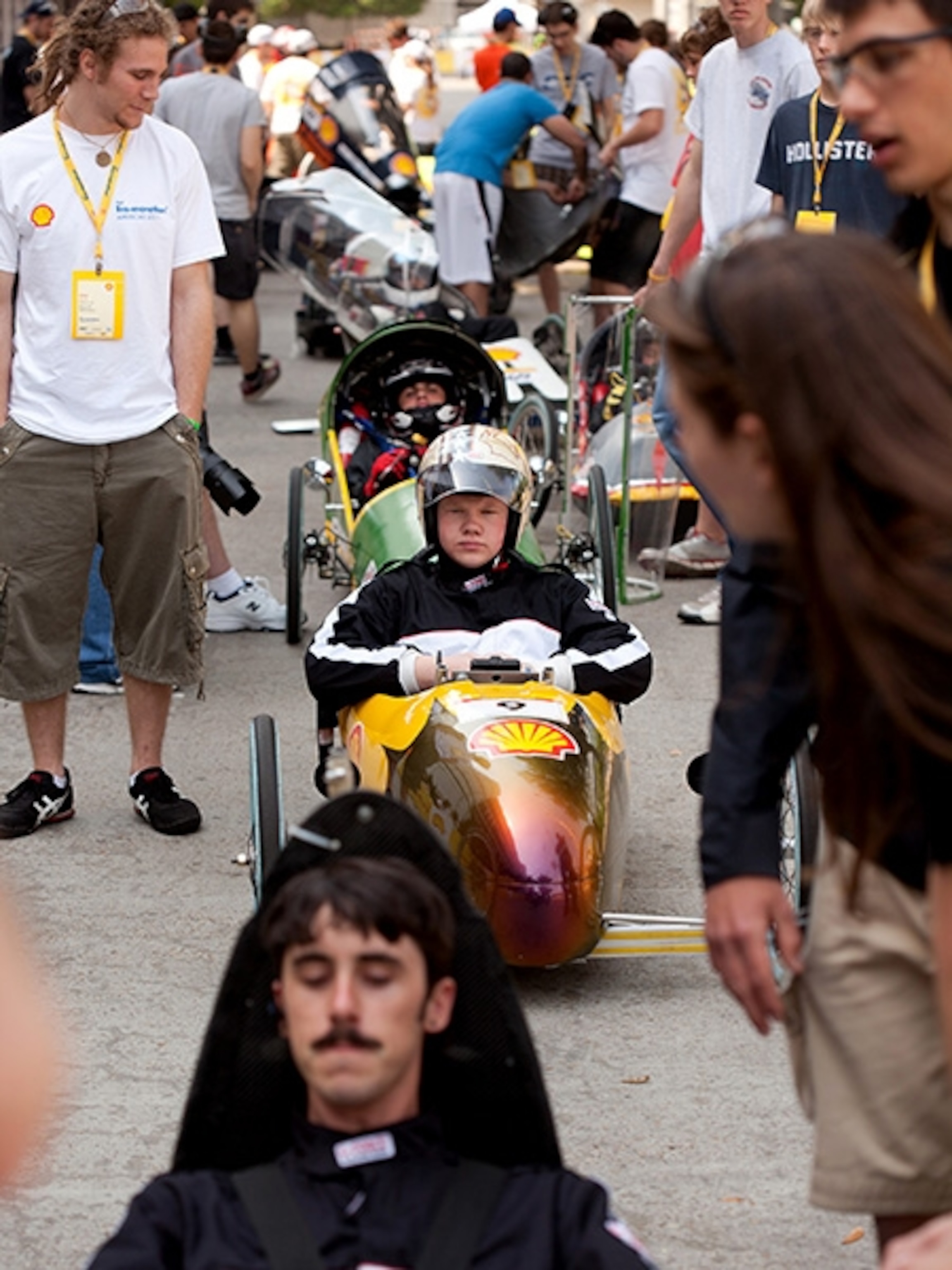 Matt Migliorini, an senior at Sullivan (Indiana) High School, waits in line for the test runs of the prototype cars at the Eco-Marathon.