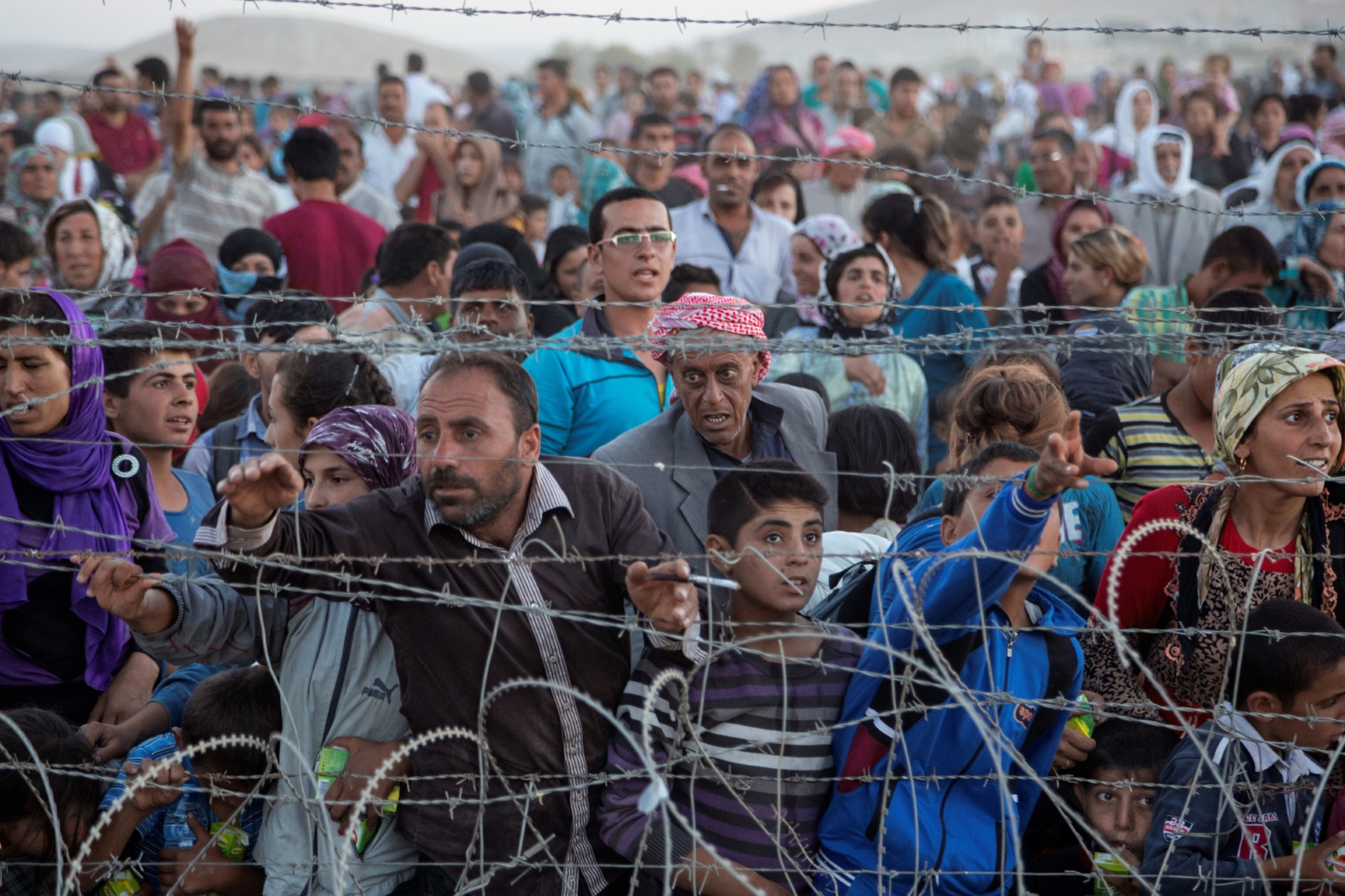 ethnic Kurds from Syria at the Turkish border