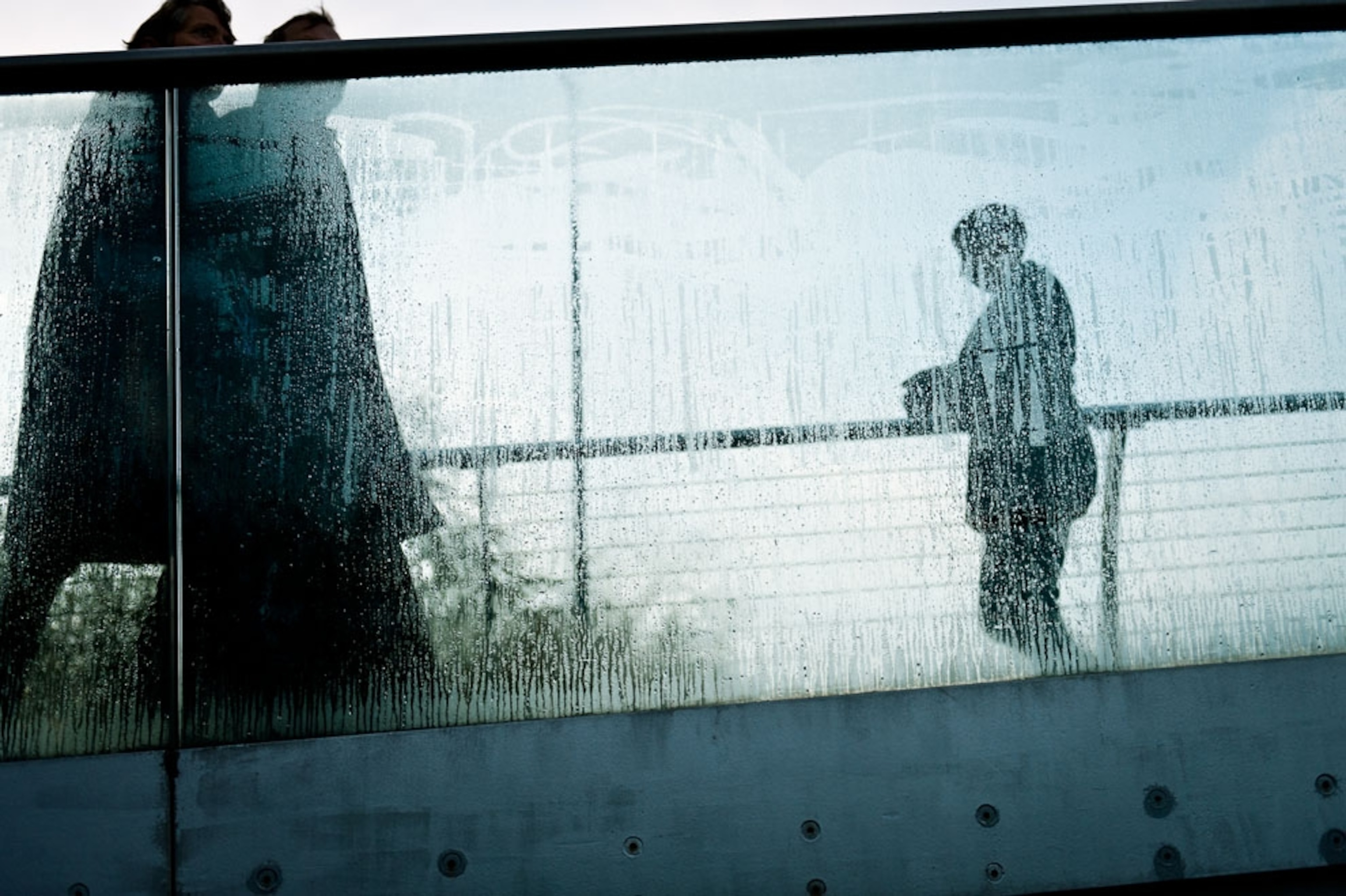People walking across the Millennium Bridge in London
