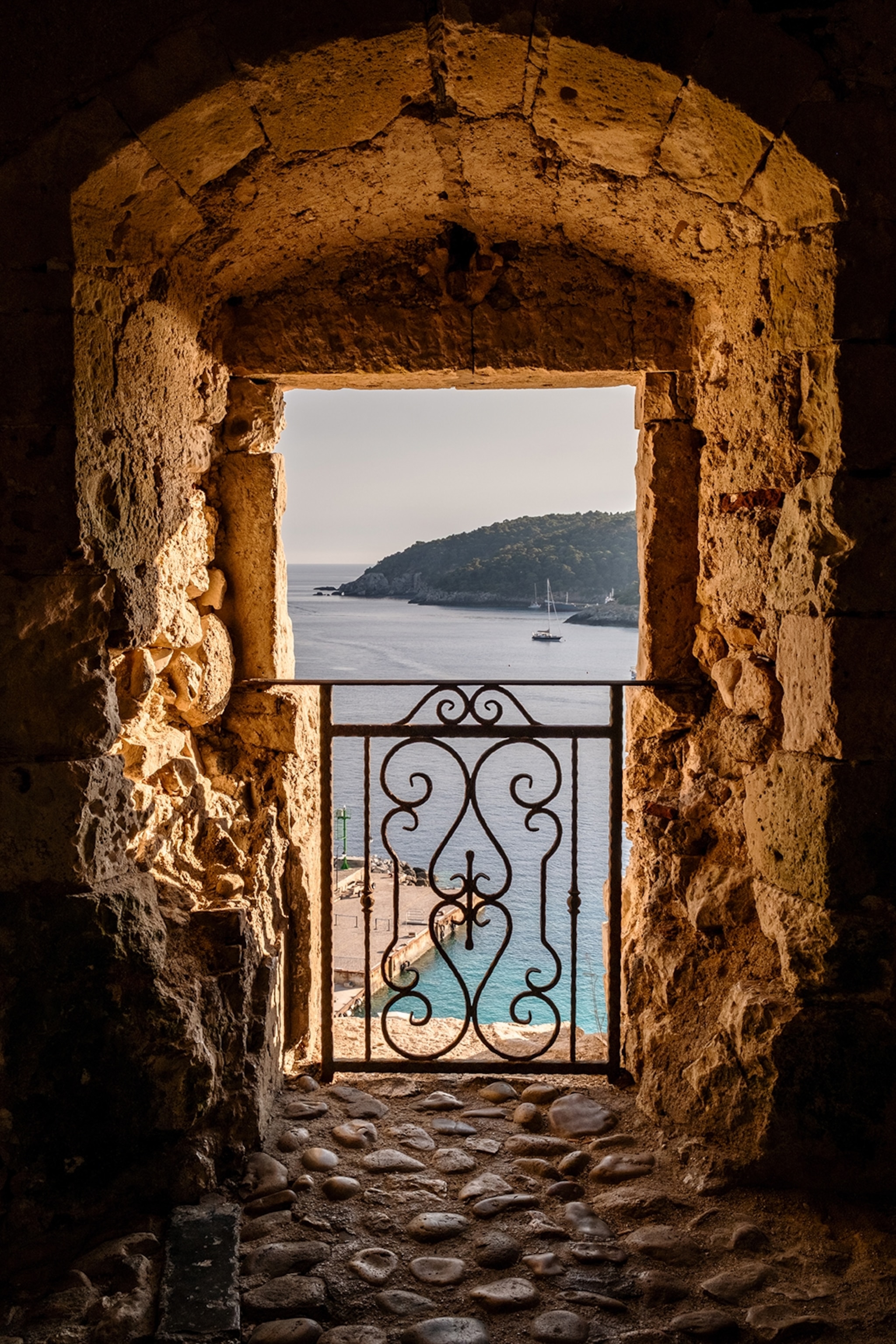 The view from inside a rampart onto a rugged coastline and the ocean.e