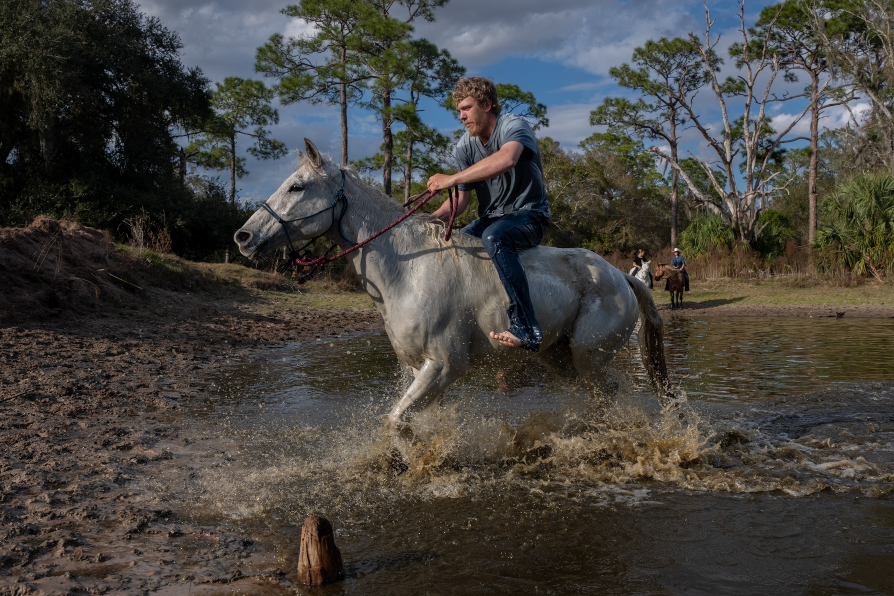 A man on a white horse.
