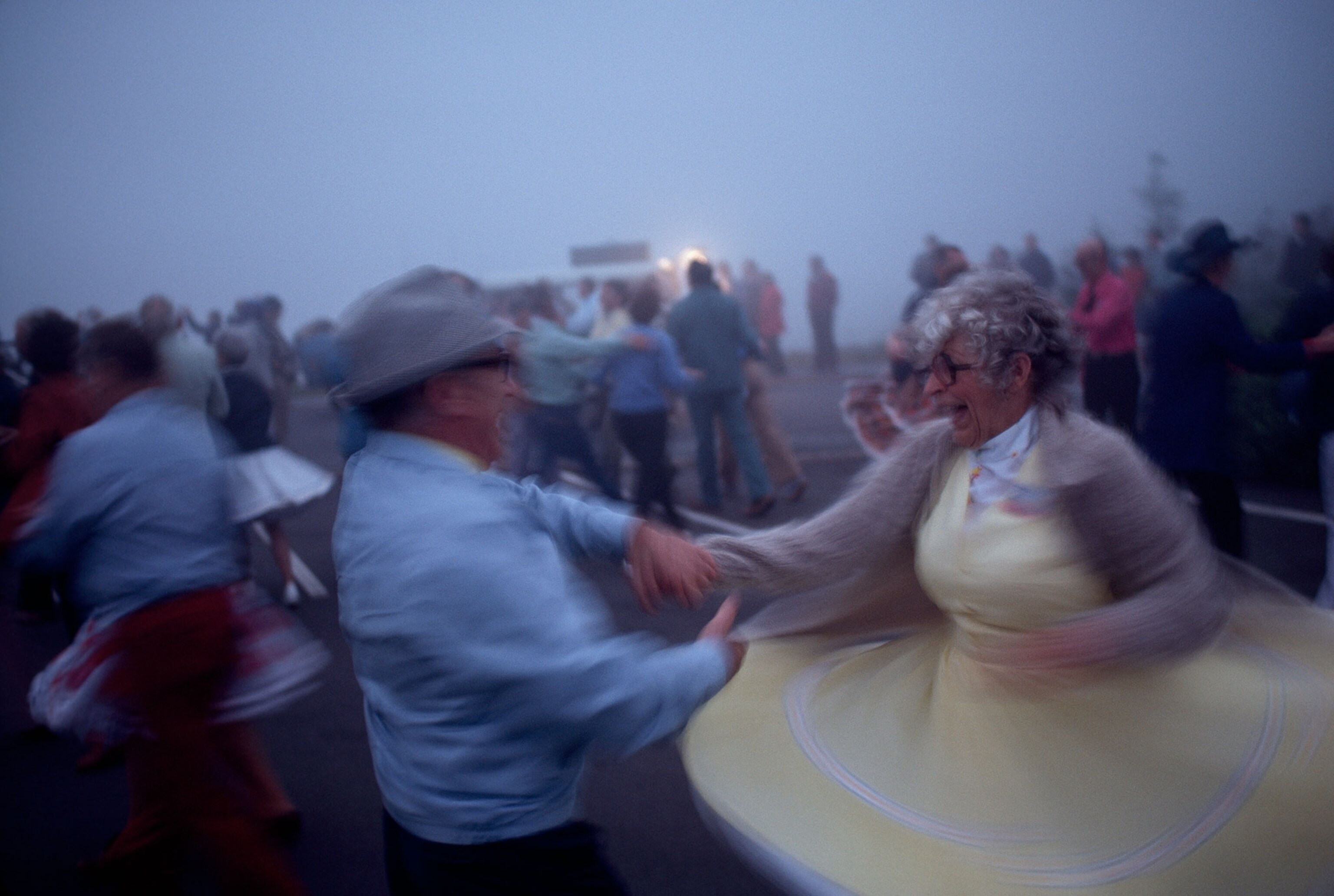 an elderly couple enjoying a predawn Fourth of July square dance