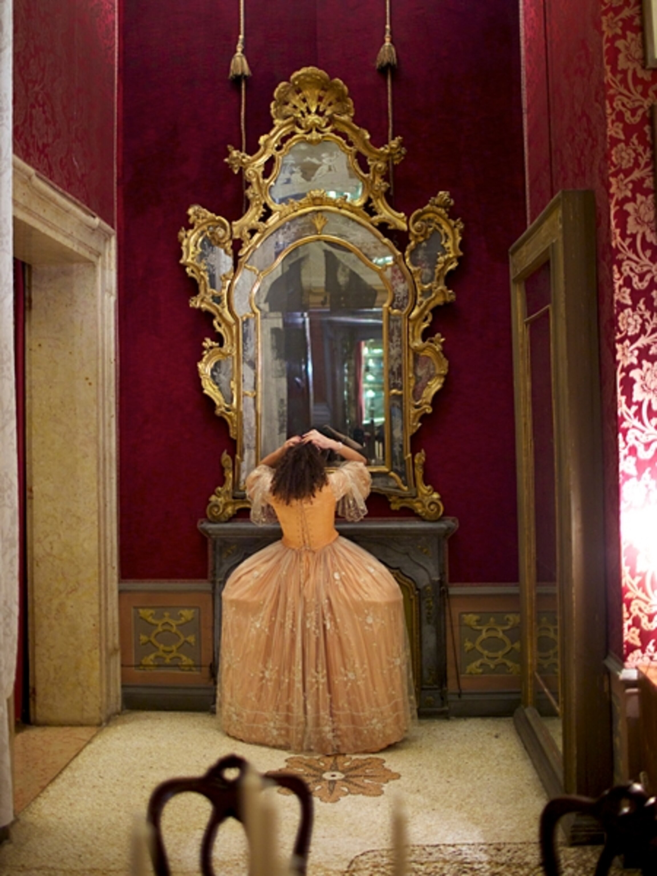 Girl looking into mirror